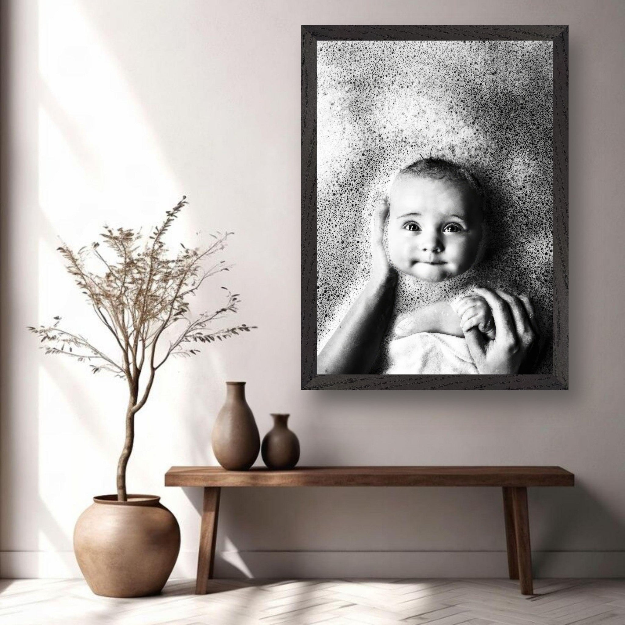 Vintage framed print of a baby smiling in bubbles, showcasing timeless childhood innocence in a serene black and white photograph.