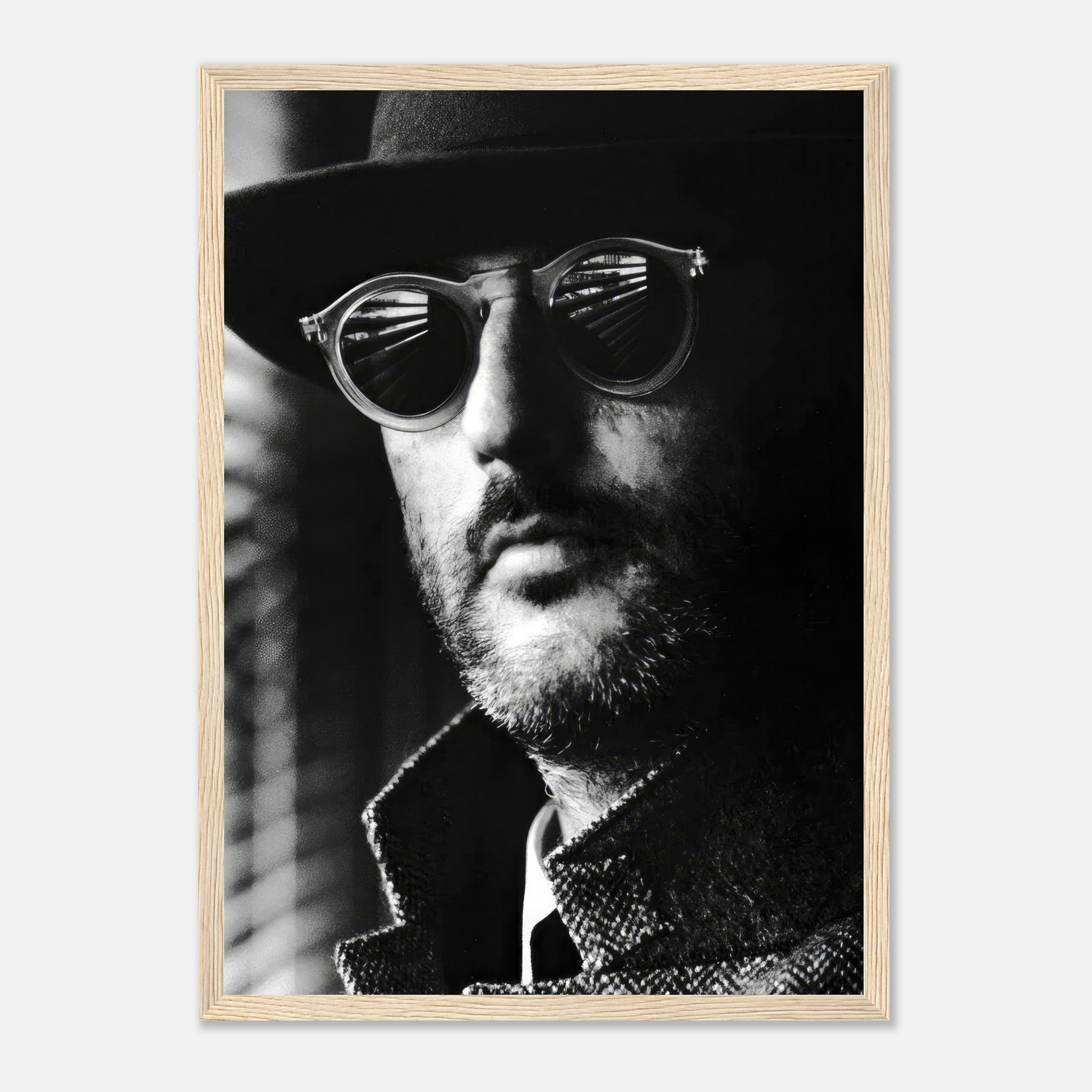 Jean Reno Leon black-and-white framed print featuring enigmatic charm and sophistication.