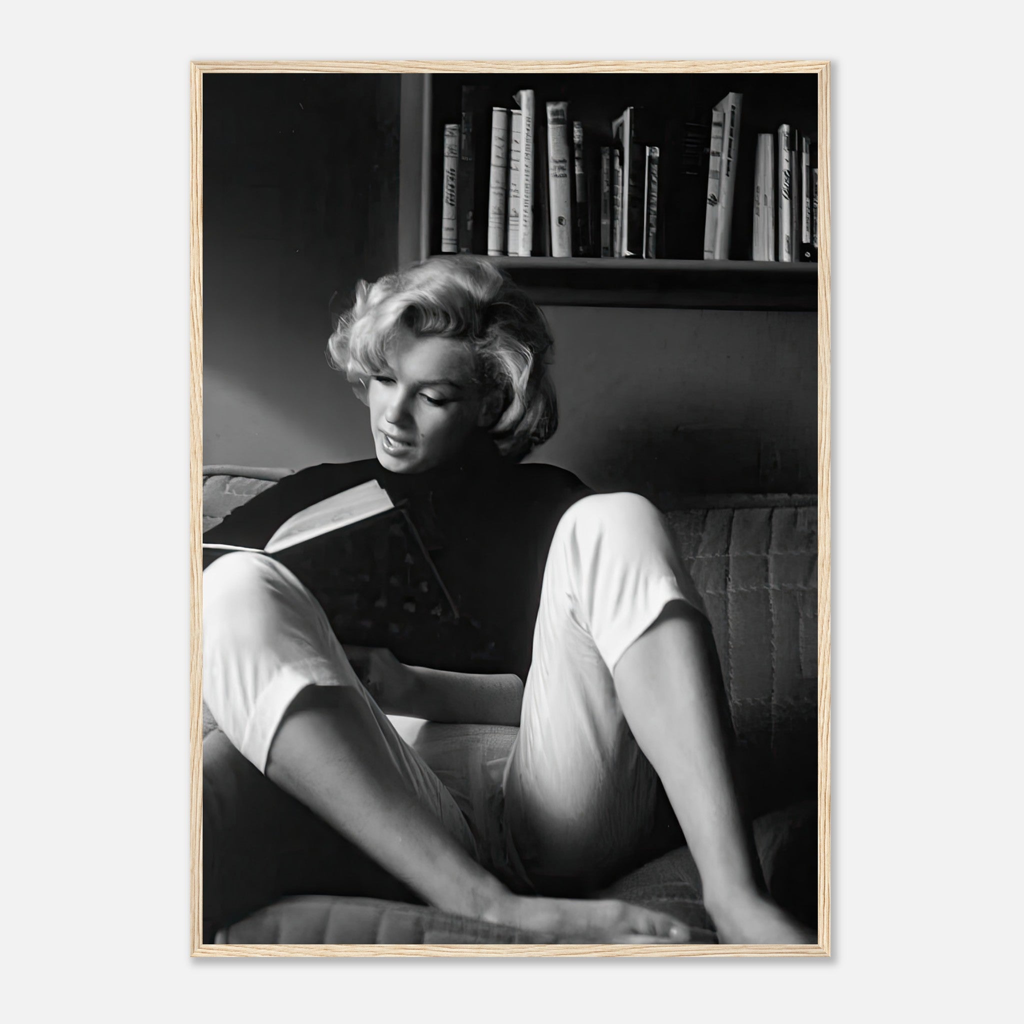 Marilyn Monroe framed print, reading at home, elegant black-and-white image showcasing vintage Hollywood charm.