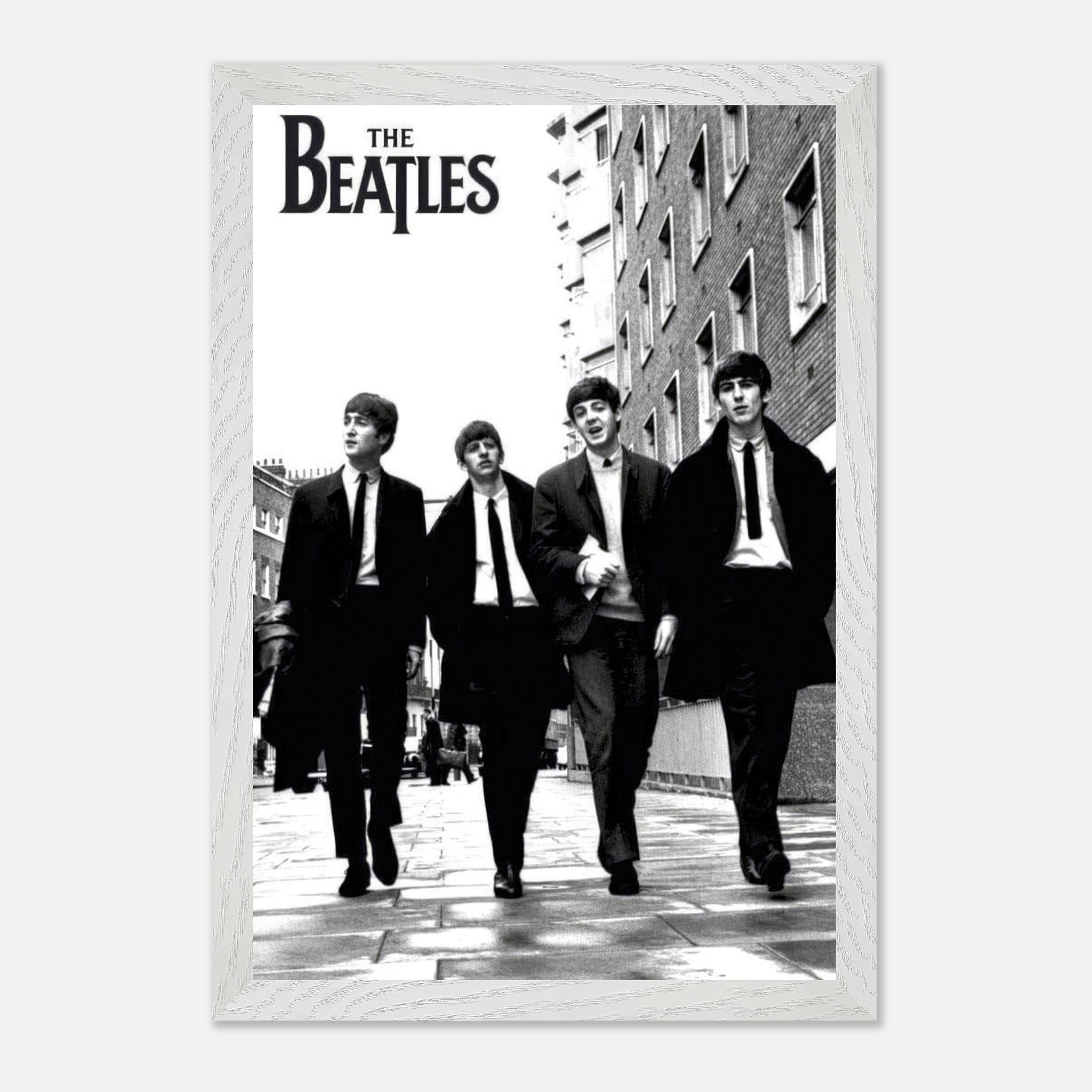 The Beatles fine art print in black and white, showcasing the iconic band walking down a city street.