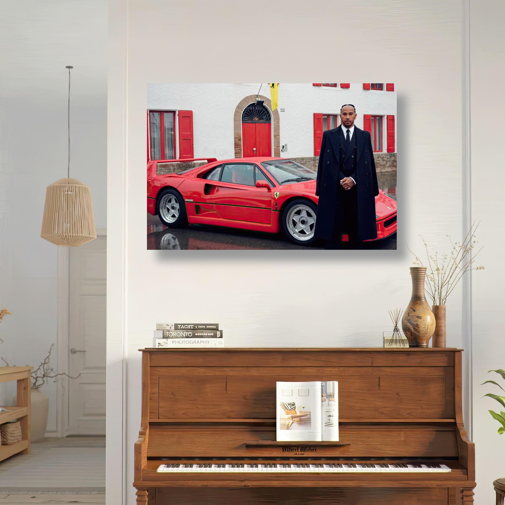 Lewis Hamilton in a suit beside a Ferrari F40, showcasing elegance and luxury in a stylish interior setting.