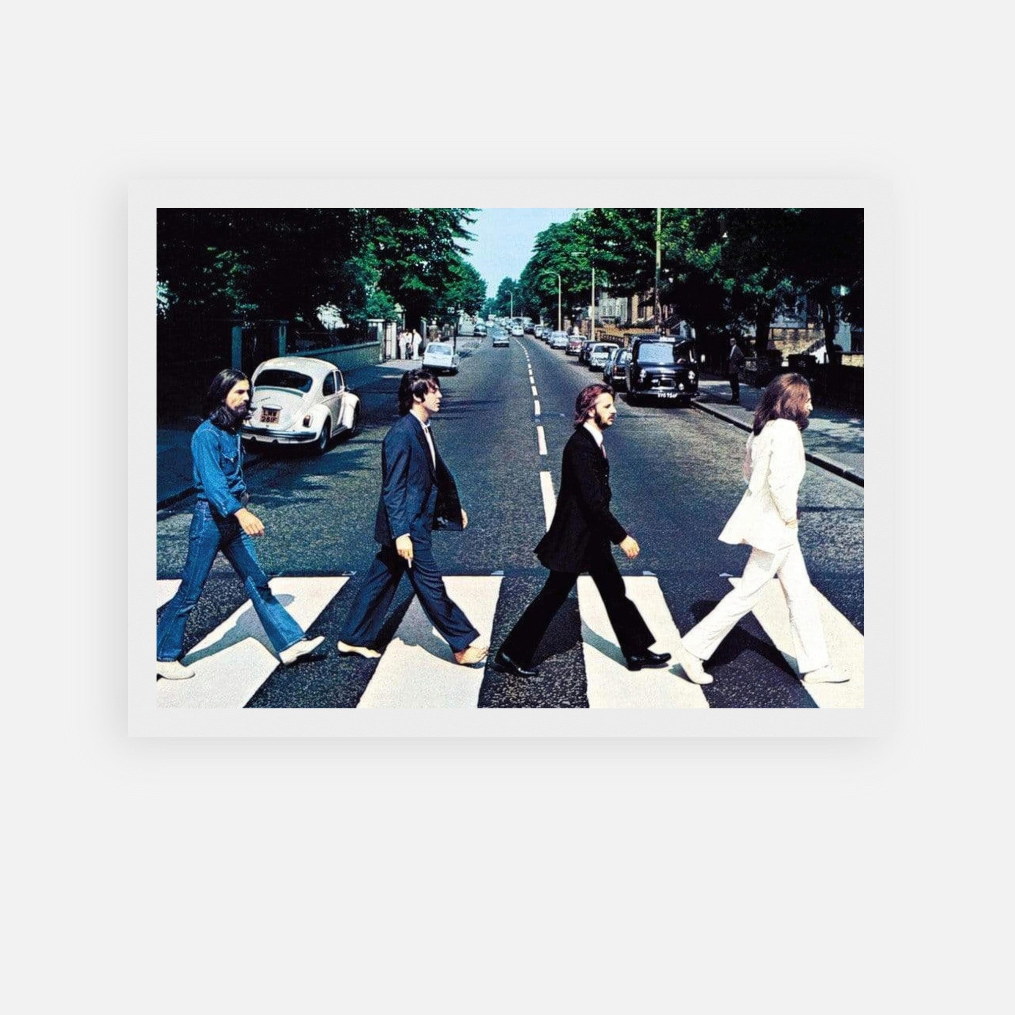 The Beatles Abbey Road framed print capturing iconic street crossing with the band members in classic poses.