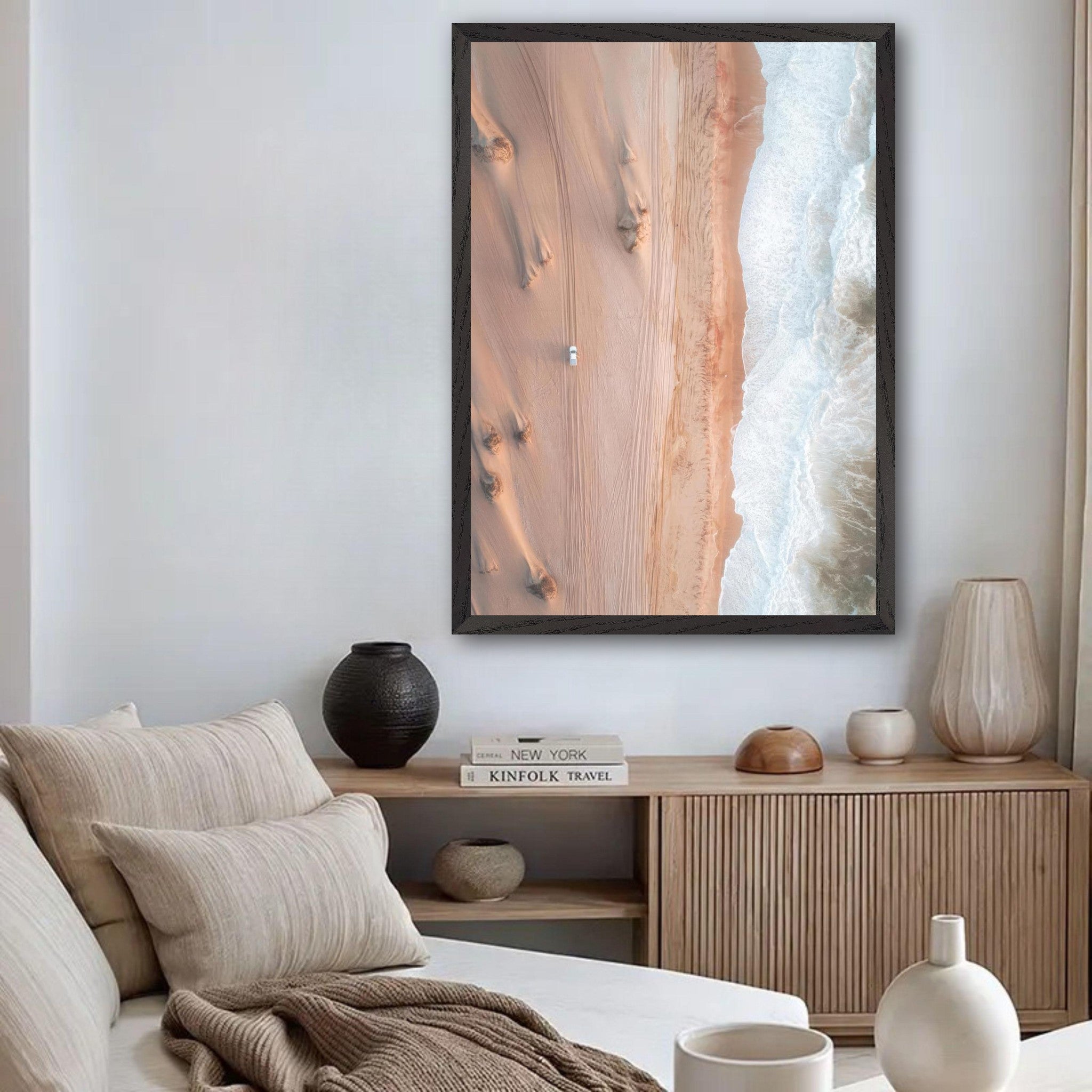 Aerial view fine art photograph titled 'Where Desert Meets Ocean' showcasing golden dunes and crashing waves.
