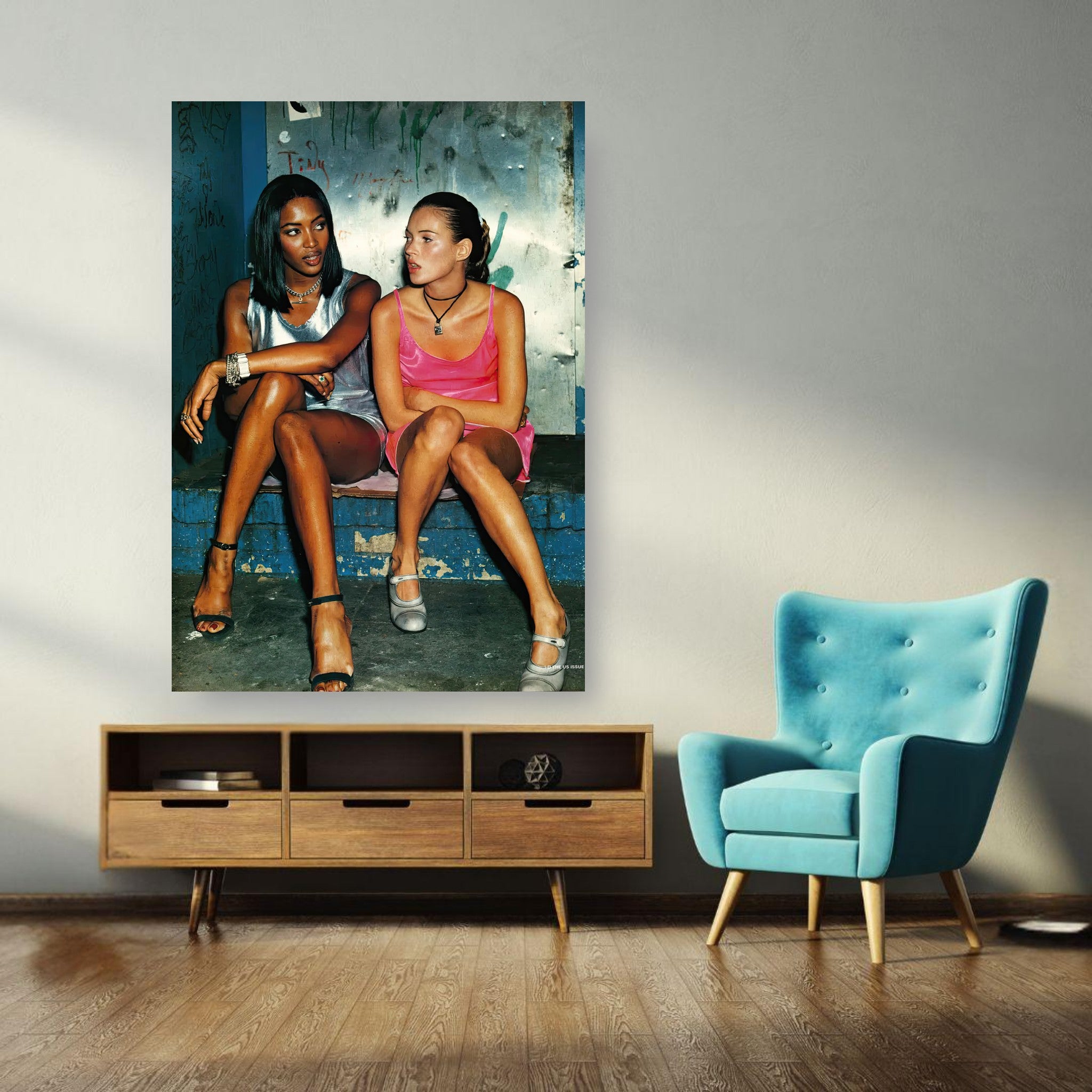 Naomi Campbell and Kate Moss poster showcasing 90s supermodel glamour in a stylish living room.