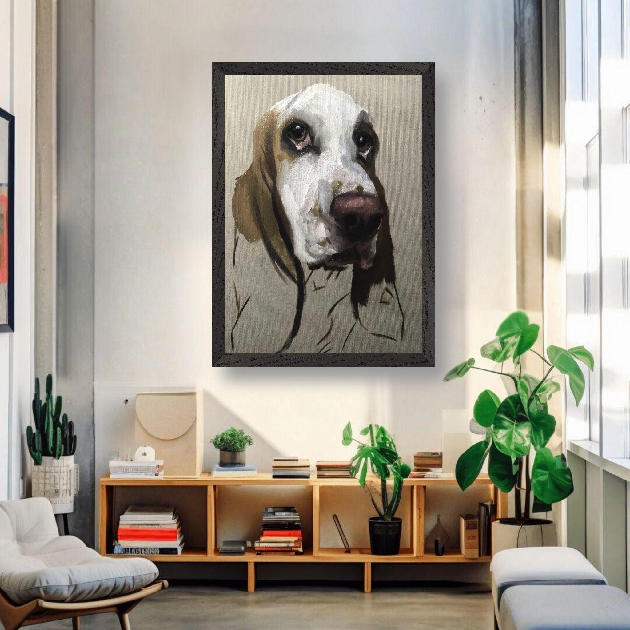 Basset Hound dog painting in a vintage frame displayed in a stylish modern living room with plants.