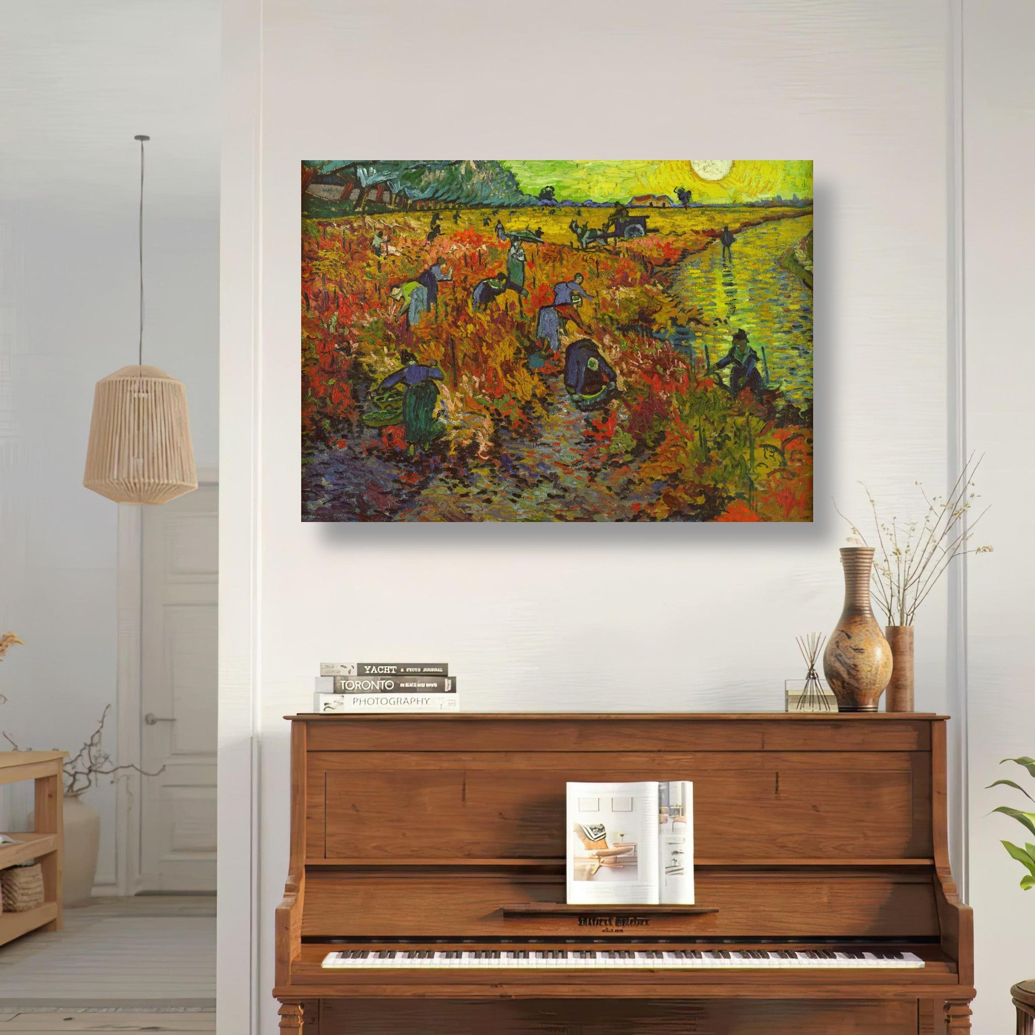 The Red Vineyard by Van Gogh poster displayed above a piano in a bright room, showcasing vibrant colors and bold brushstrokes.