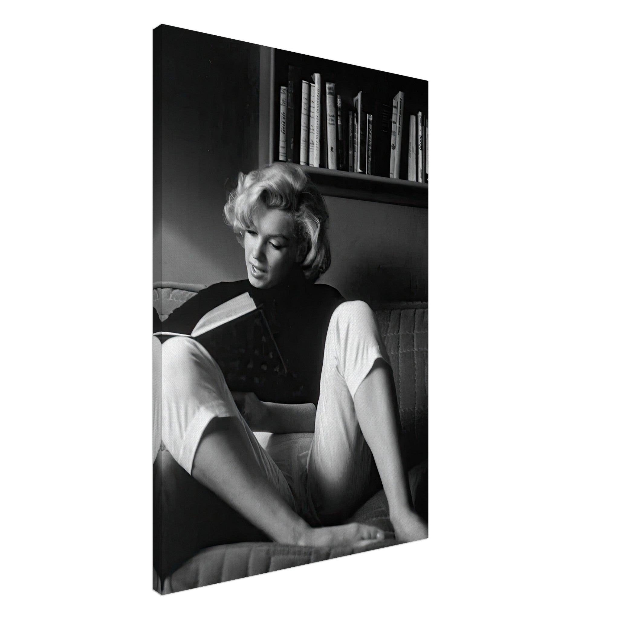 Marilyn Monroe reading at home in black-and-white canvas art, capturing elegance and Hollywood glamour.