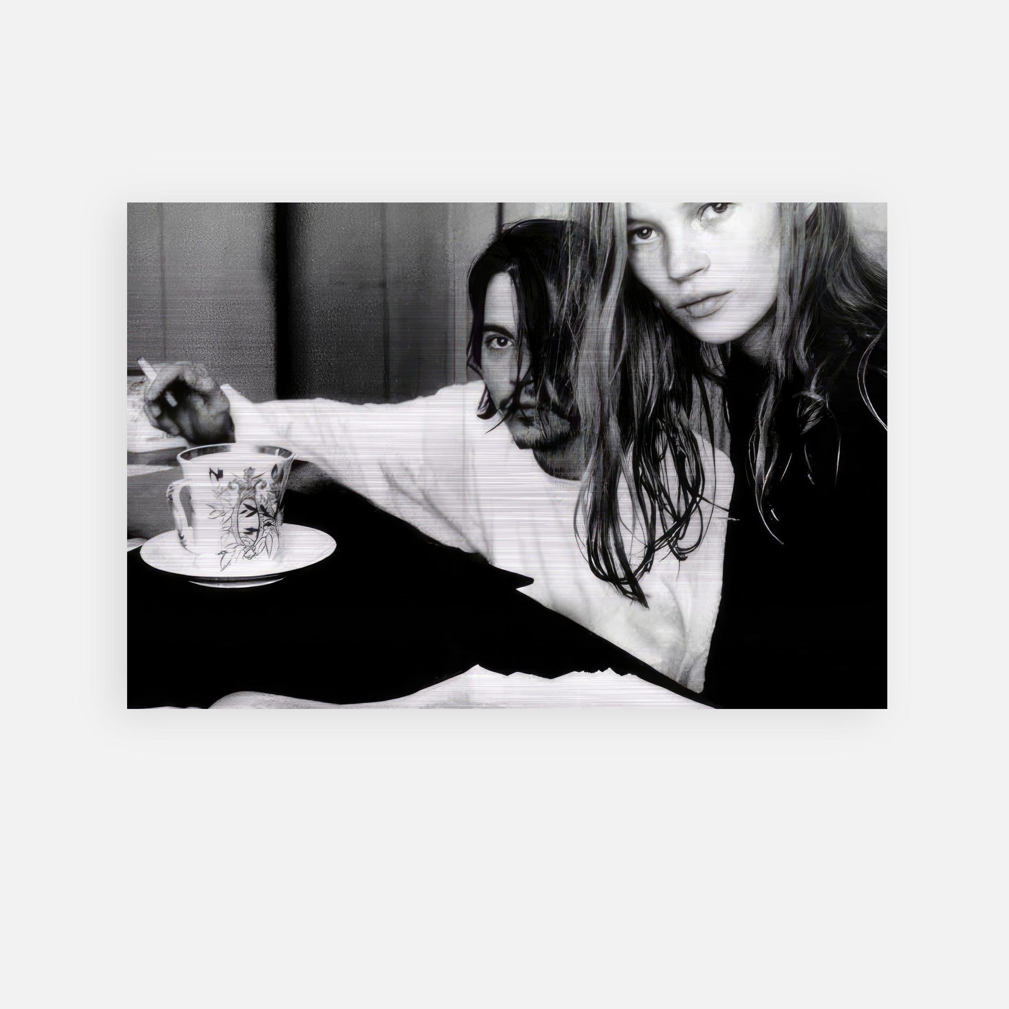 Black and white brushed metal print of Johnny Depp and Kate Moss capturing their iconic candid moment.