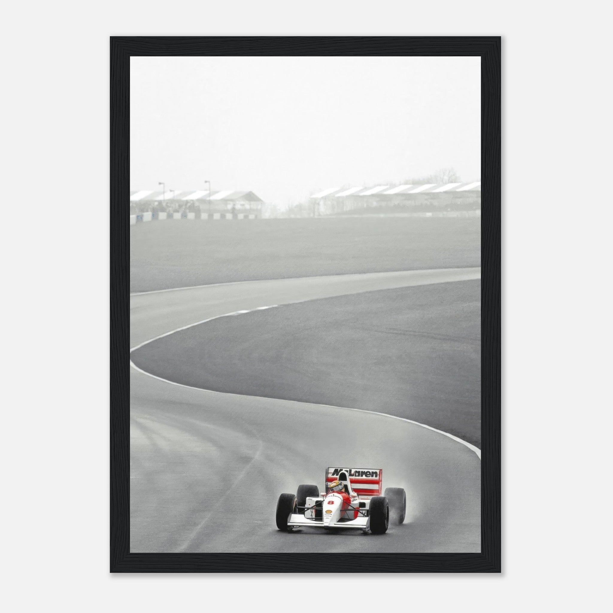 1988 Ayrton Senna driving McLaren MP4/4 on track in black and white framed print, capturing racing history.