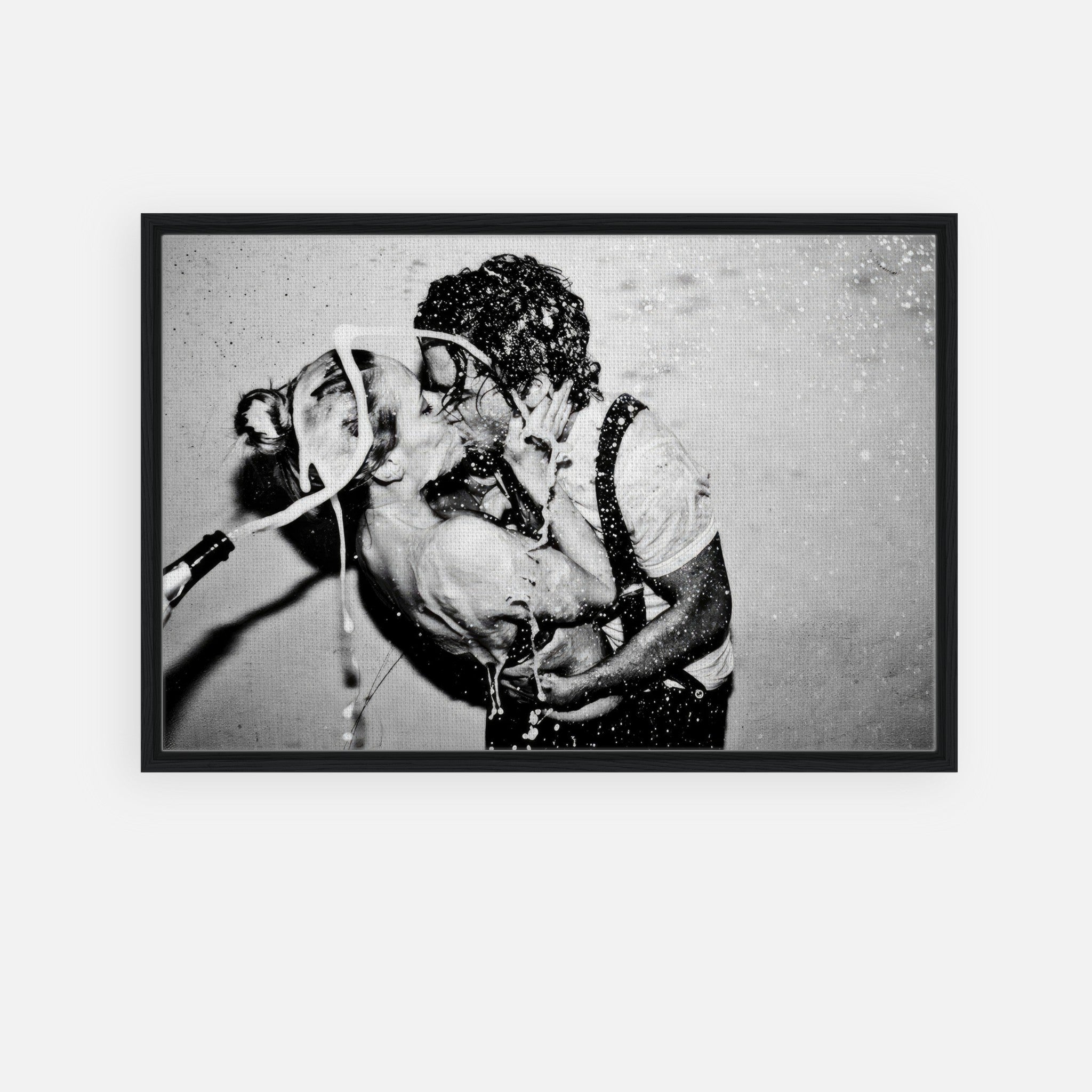 Black-and-white canvas print of Johnny Depp and Kate Moss sharing a passionate kiss with champagne splashing.