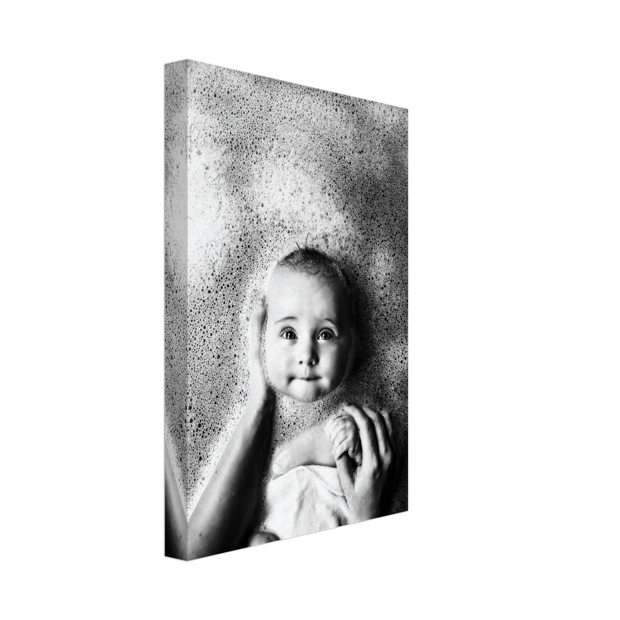 Black-and-white canvas print of a baby in a bubble bath, showcasing joy and innocence.