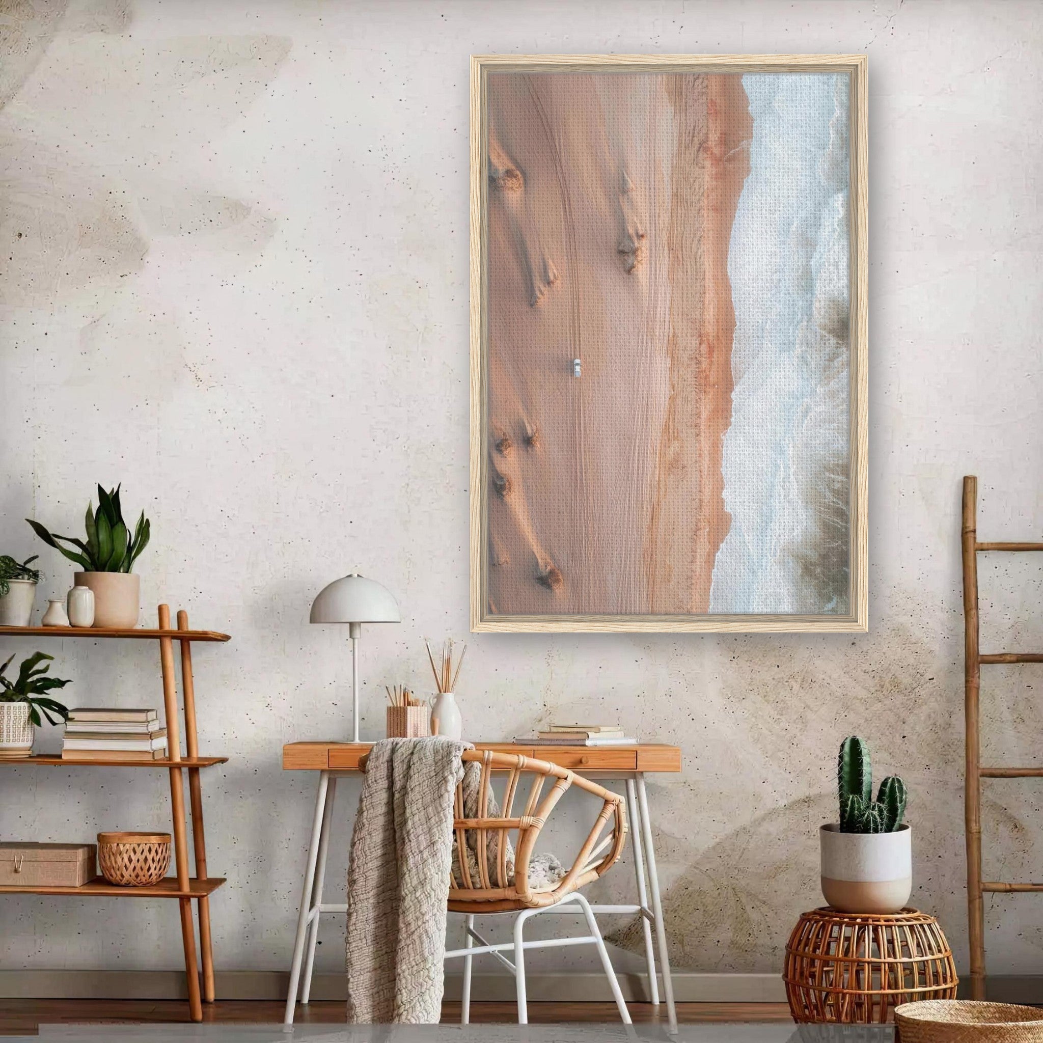 Framed canvas print of desert meeting ocean in modern interior, showcasing aerial drone photography.