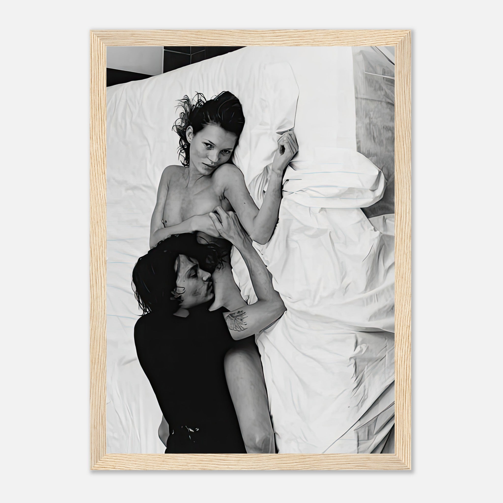 Framed print of Kate Moss and Johnny Depp, iconic black-and-white image from 1994, capturing pop culture glamour.