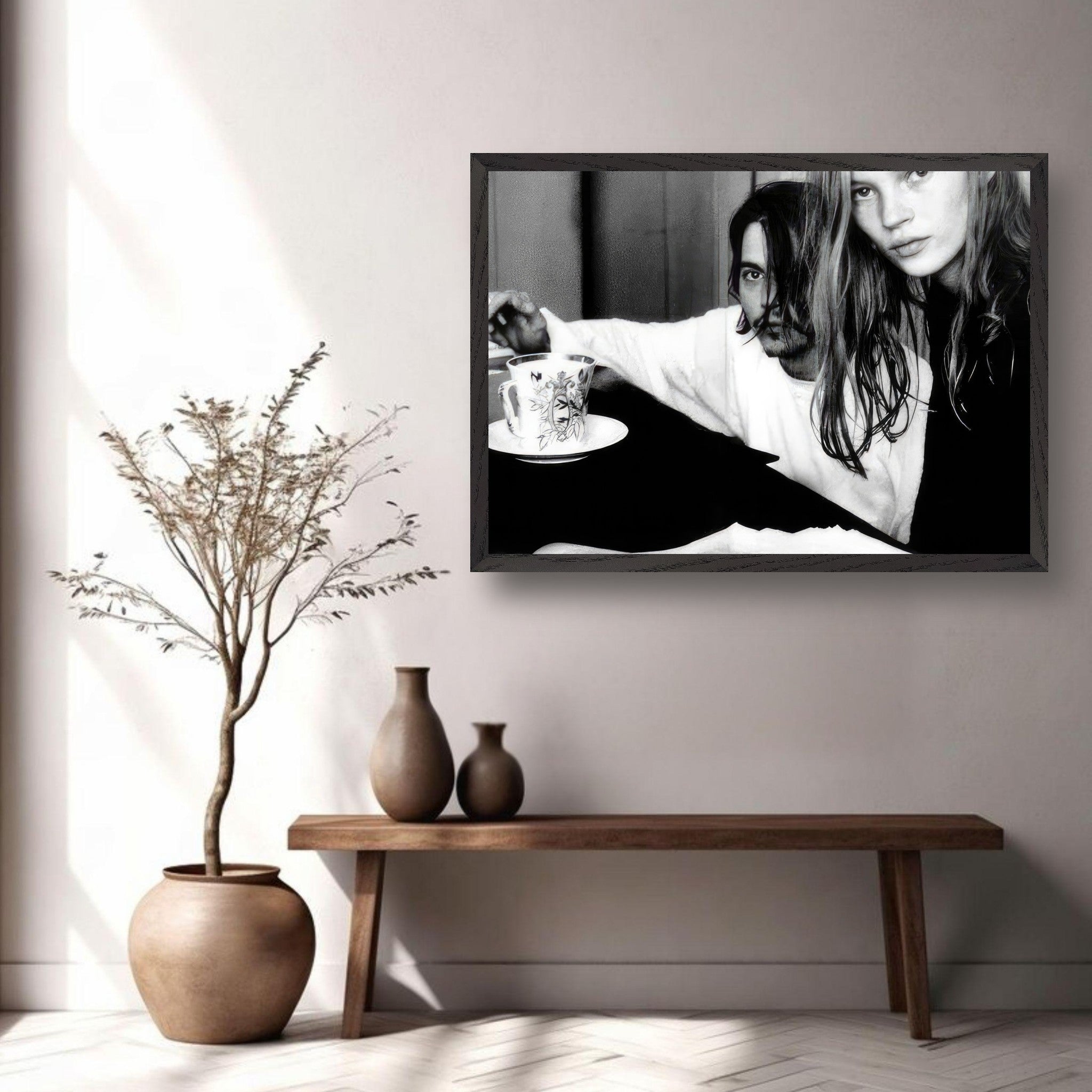 Black-and-white fine art print of Johnny Depp and Kate Moss in a stylish interior setting.