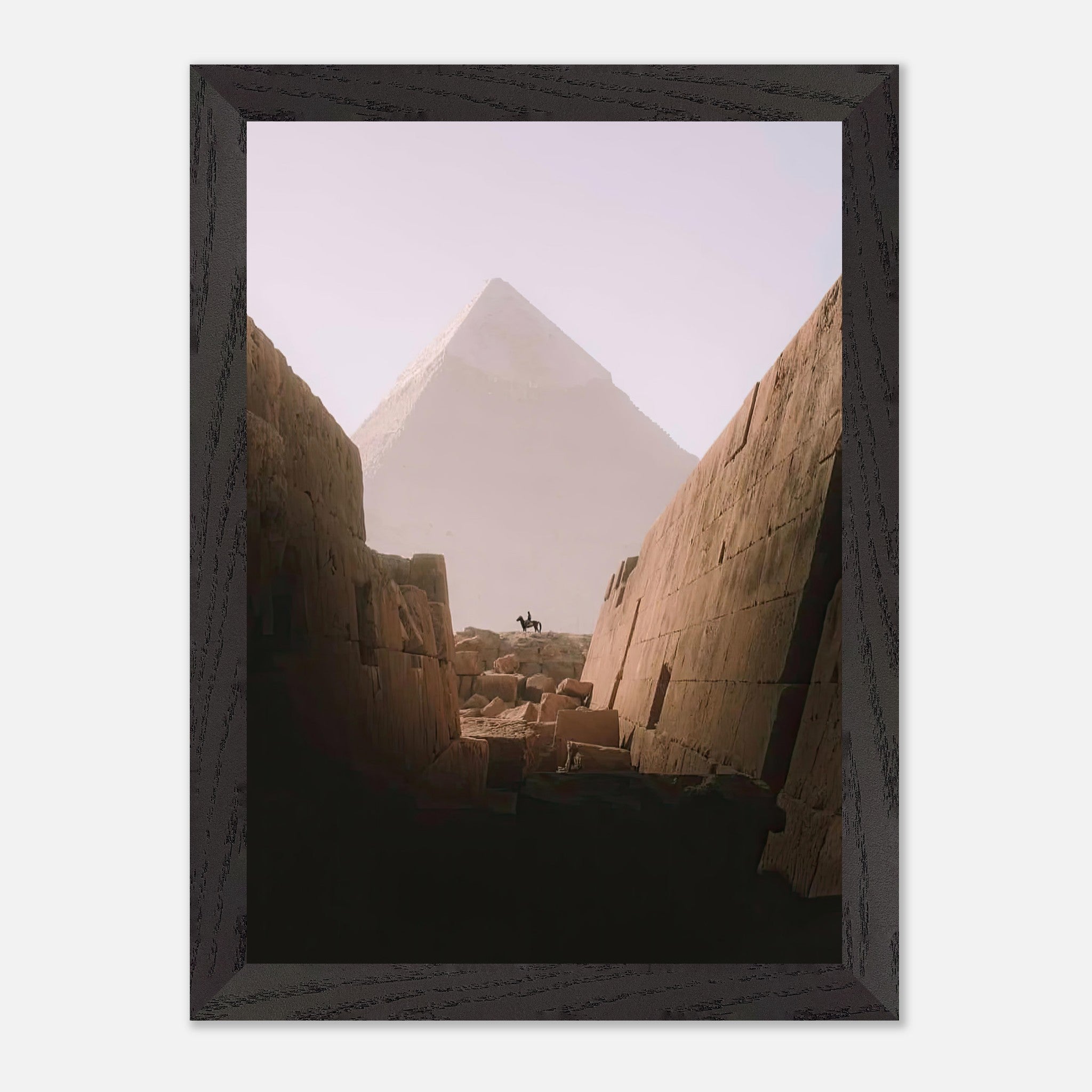 Vintage framed print of a rider on horseback in front of the Great Pyramid of Giza, evoking ancient Egypt's beauty.