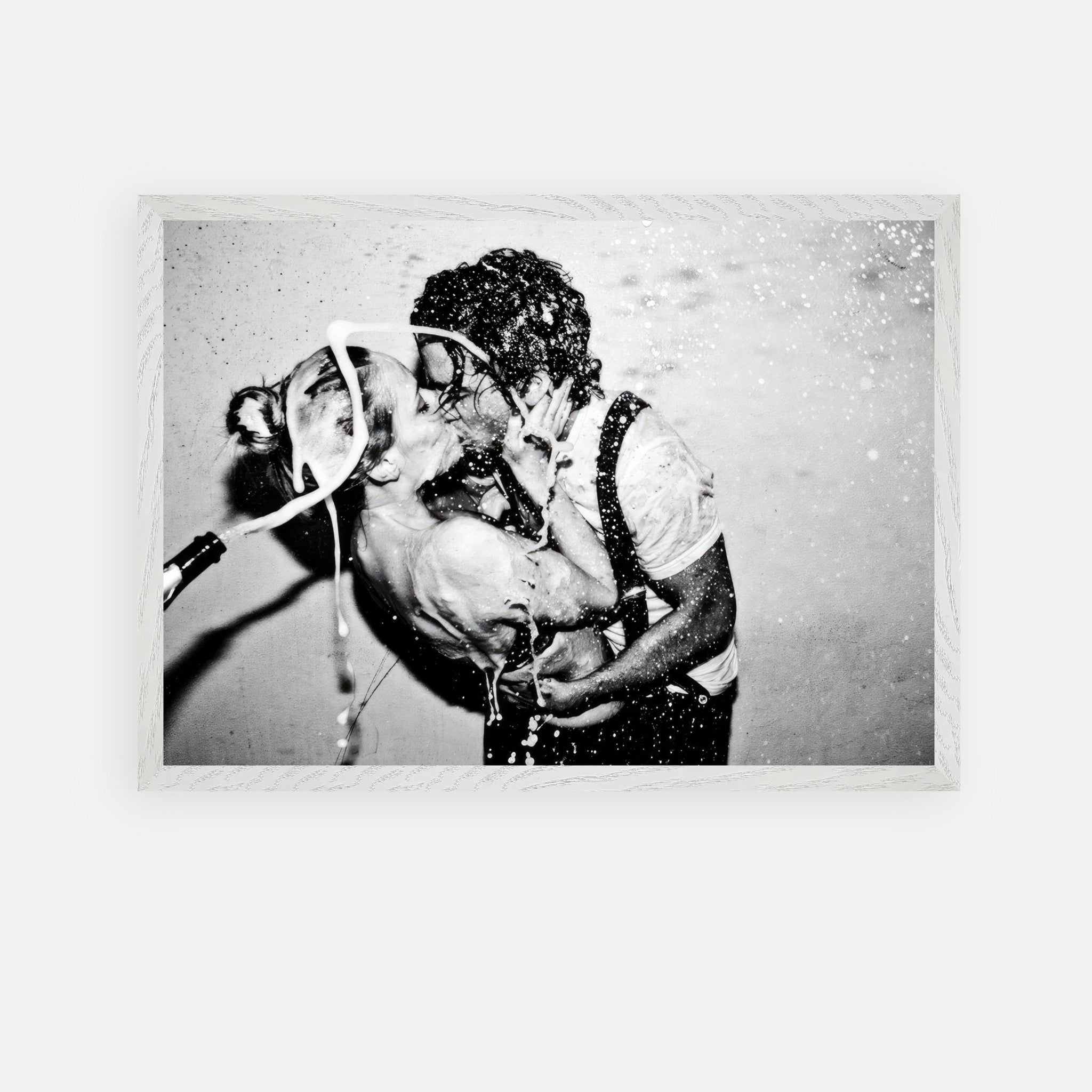 The Champagne Kiss art print featuring Johnny Depp and Kate Moss, showcasing a passionate moment in black and white.