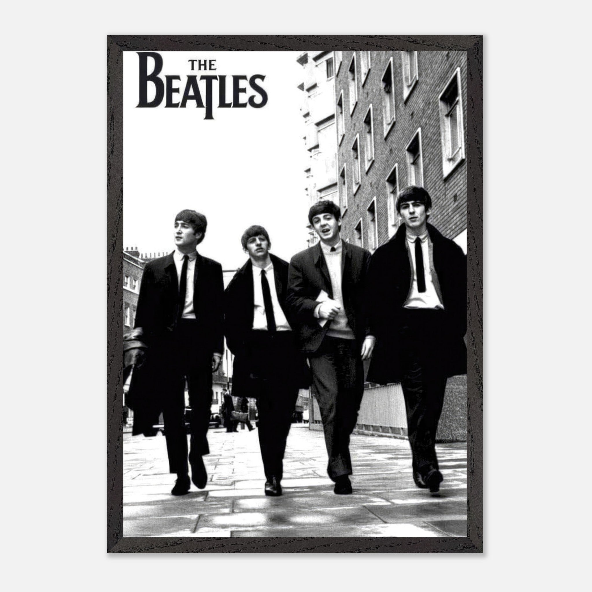 Vintage framed print of The Beatles walking down the street in black and white, capturing classic music history.
