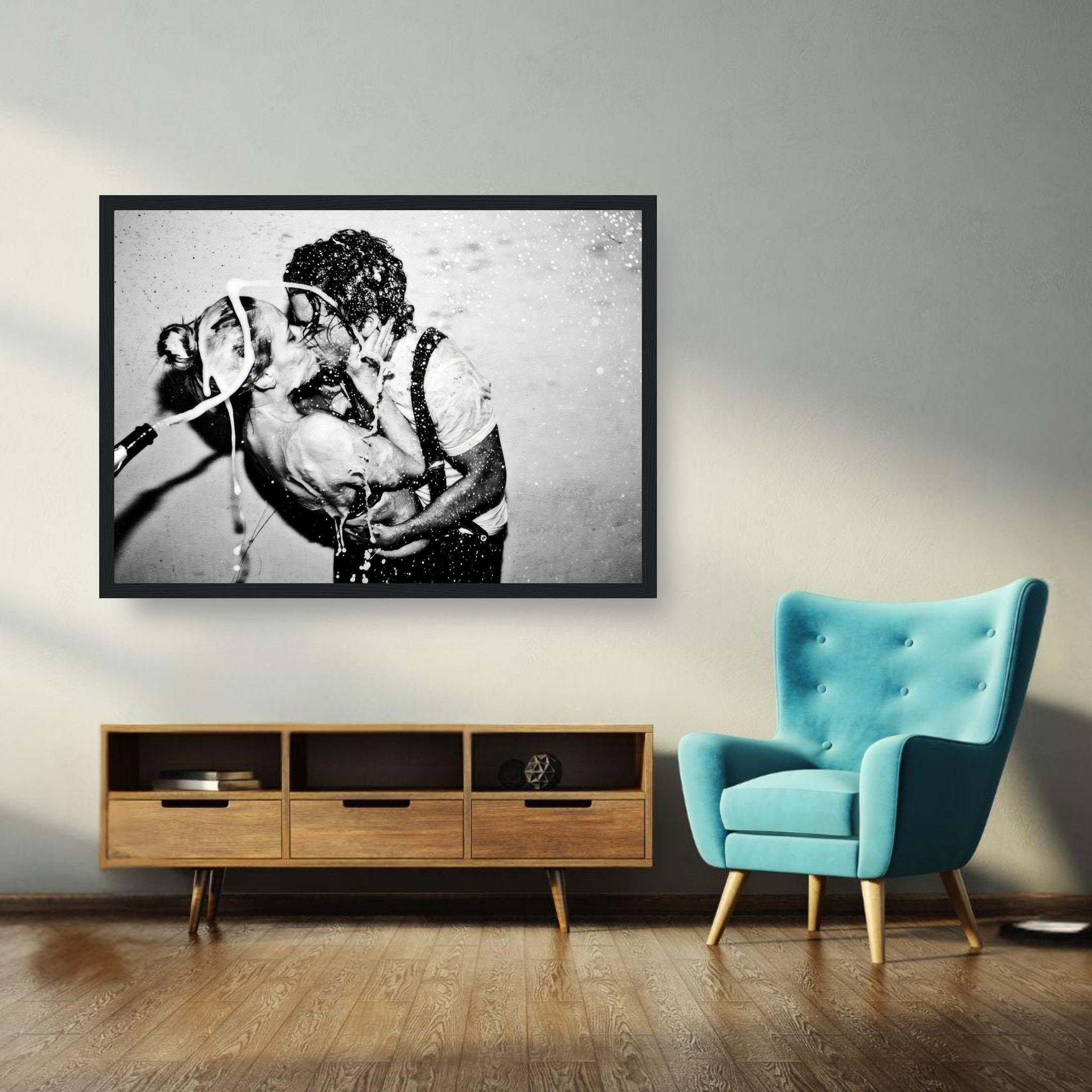 Framed print of Johnny Depp and Kate Moss sharing a passionate kiss with champagne explosion, capturing glamour and style.