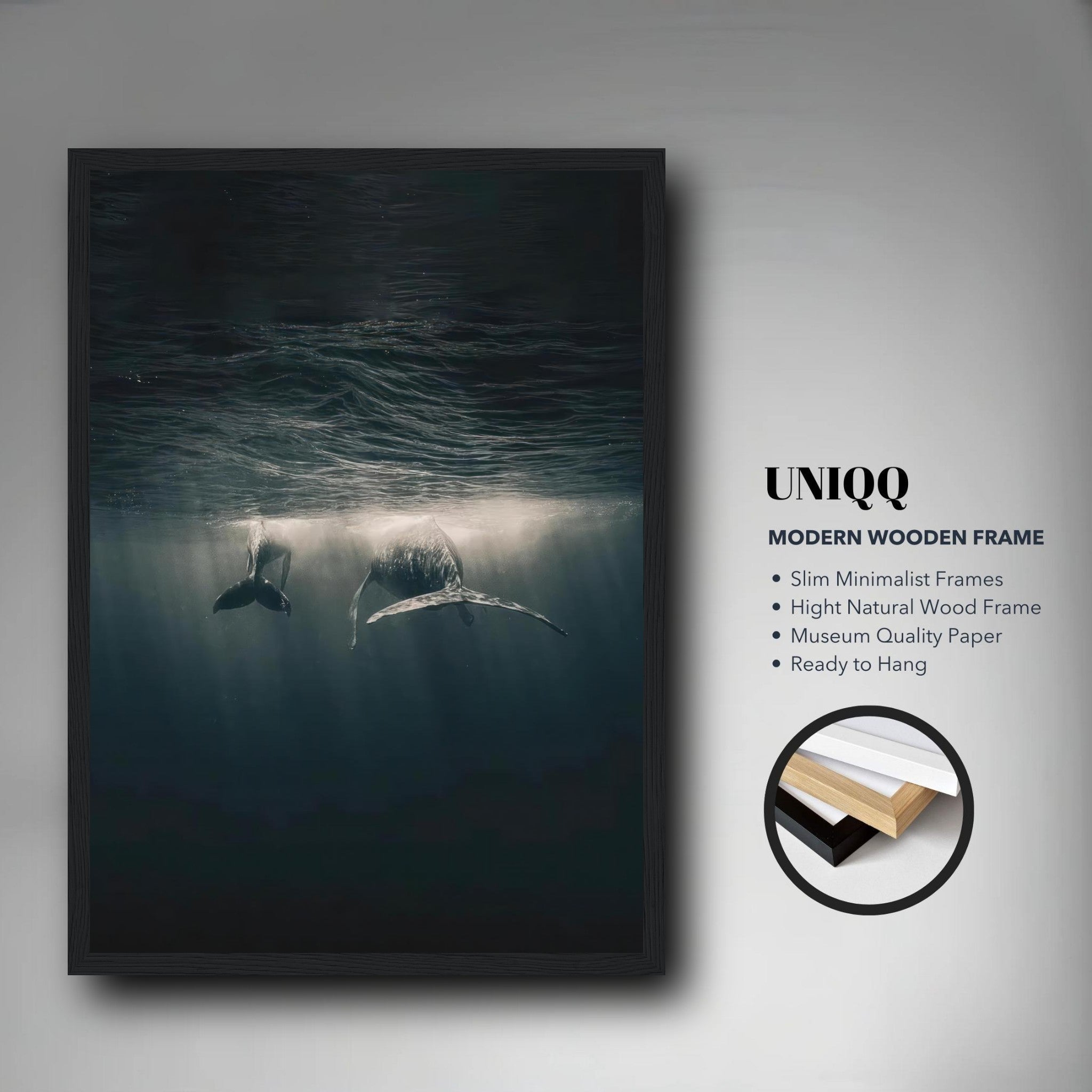 Framed print of two whales underwater, showcasing ocean beauty with soft sunlight rays.