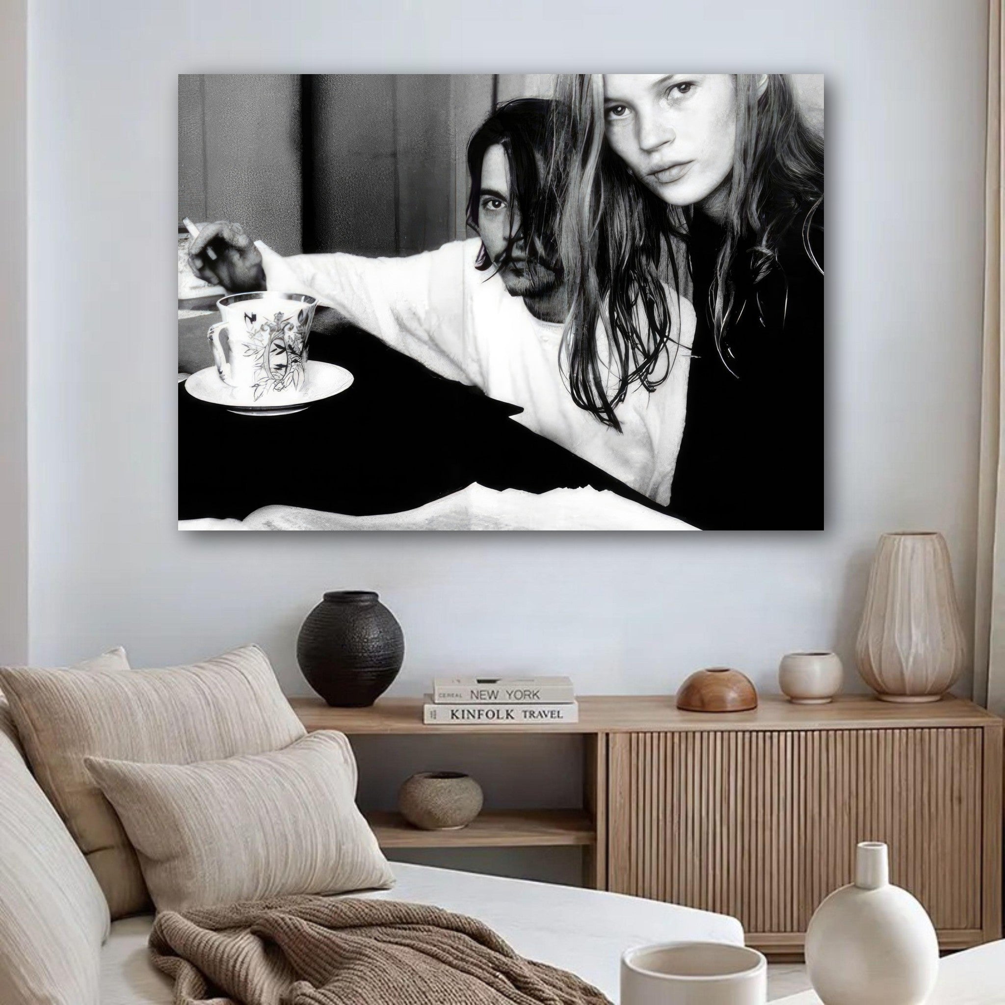 Black-and-white poster of Johnny Depp and Kate Moss capturing 90s rock-and-roll romance in a stylish living room.