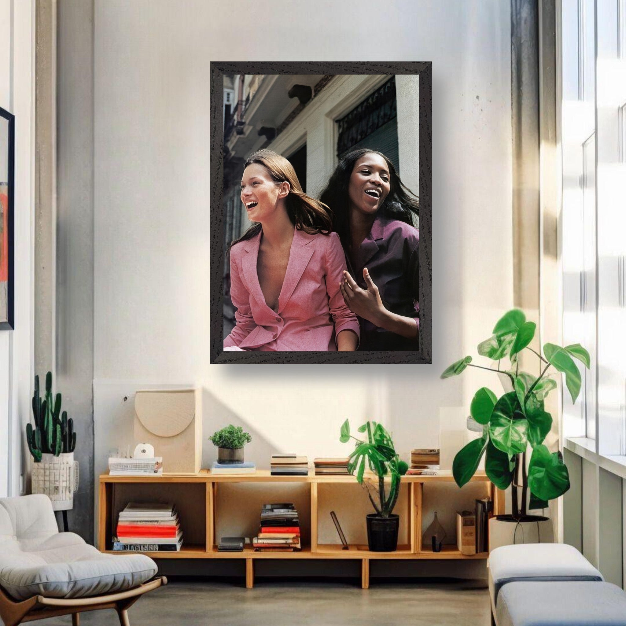 Naomi Campbell x Kate Moss vintage framed print showcasing two iconic supermodels laughing in a stylish interior.
