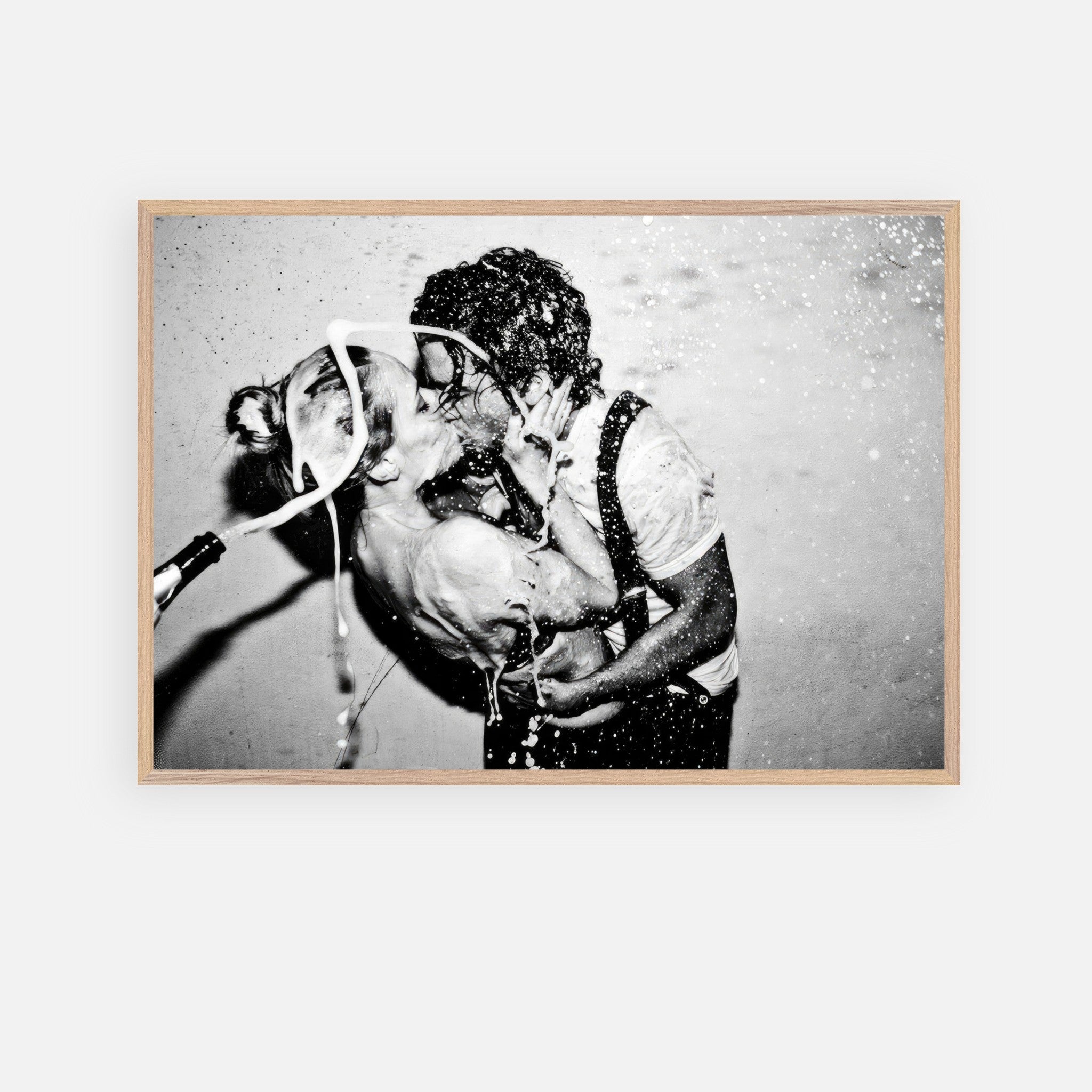 Black-and-white vintage art of Johnny Depp and Kate Moss sharing a passionate kiss with champagne celebration.