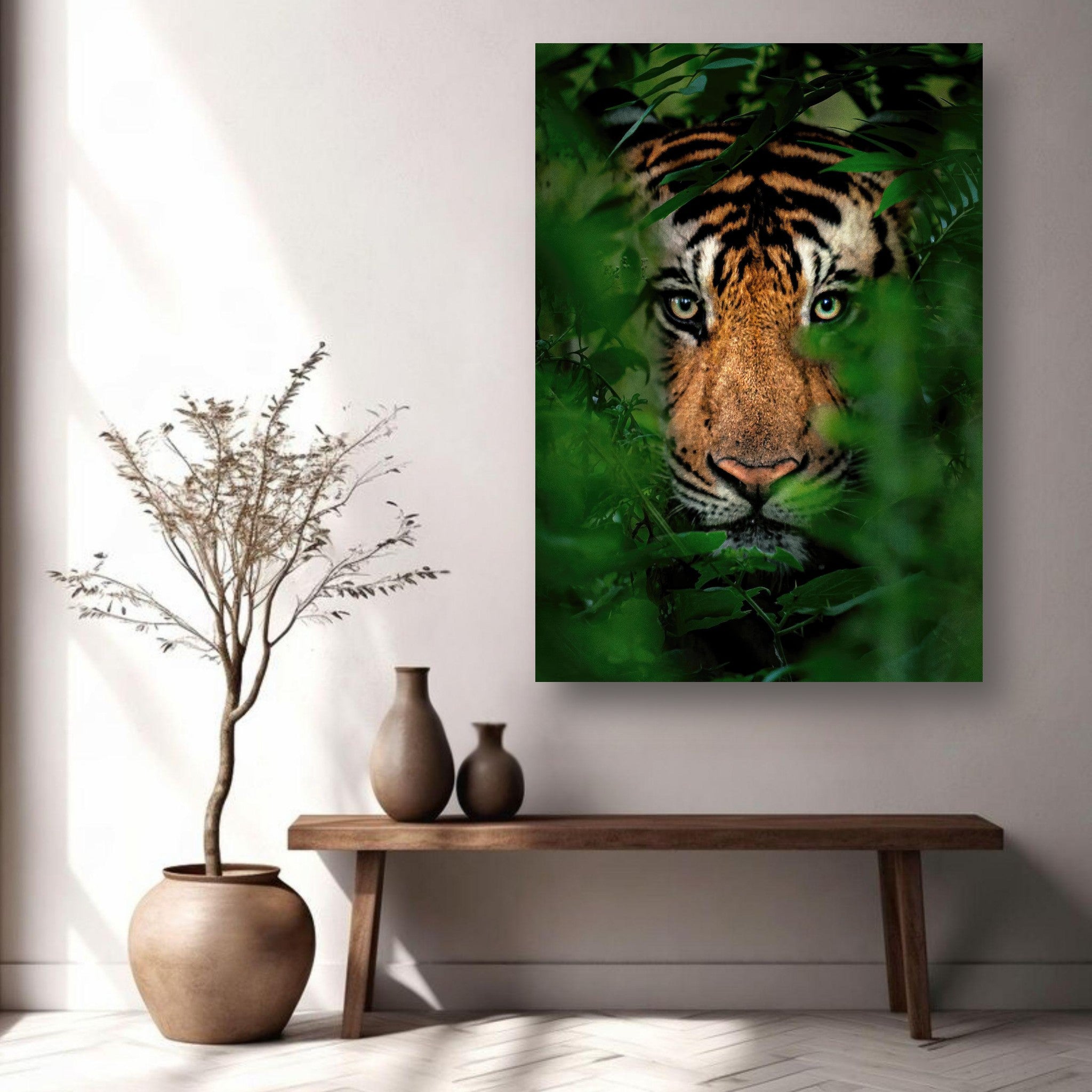 Majestic tiger peering through lush greenery in a jungle metal print, ideal for home decor.