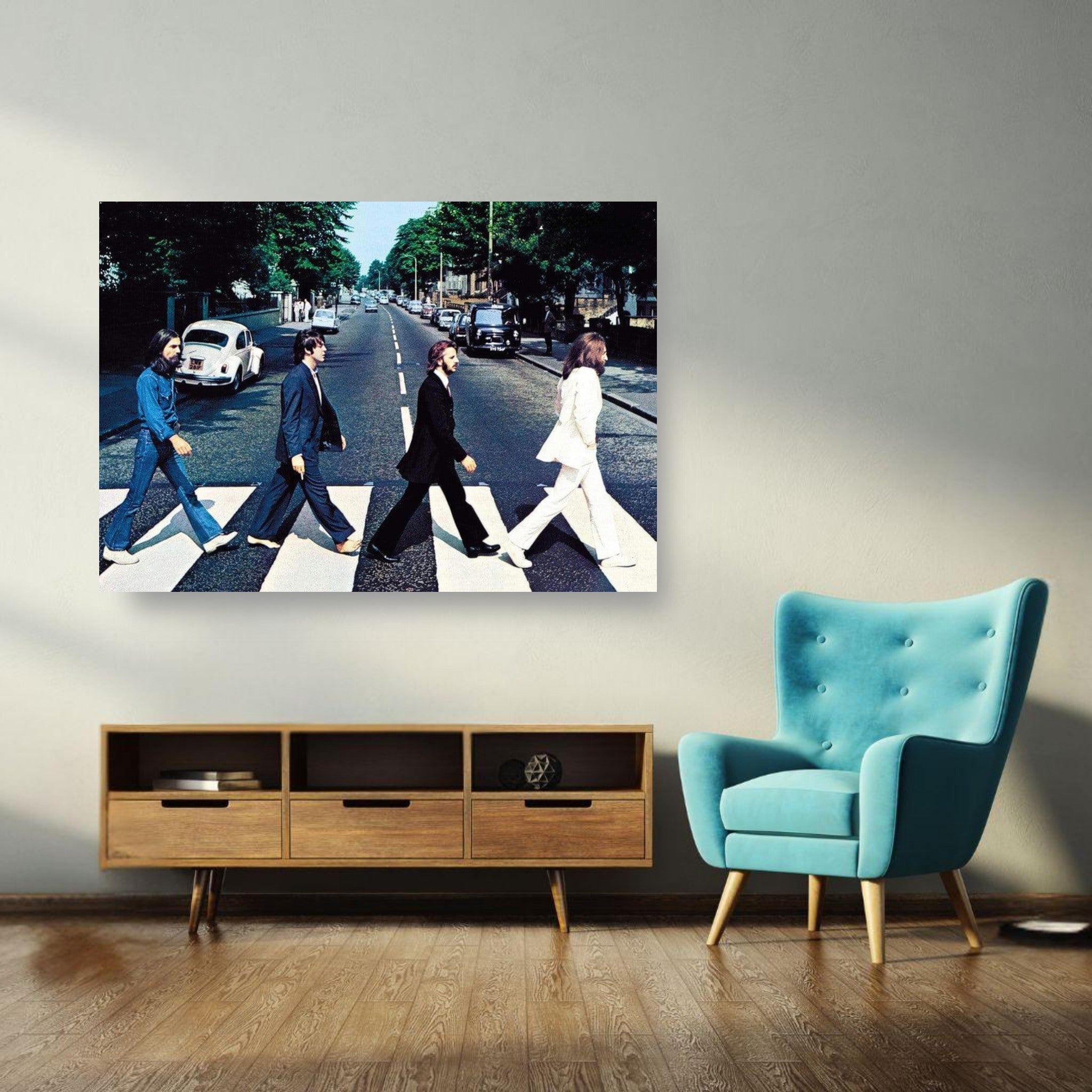 The Beatles Abbey Road metal print artwork displayed in a modern living room with blue chair.