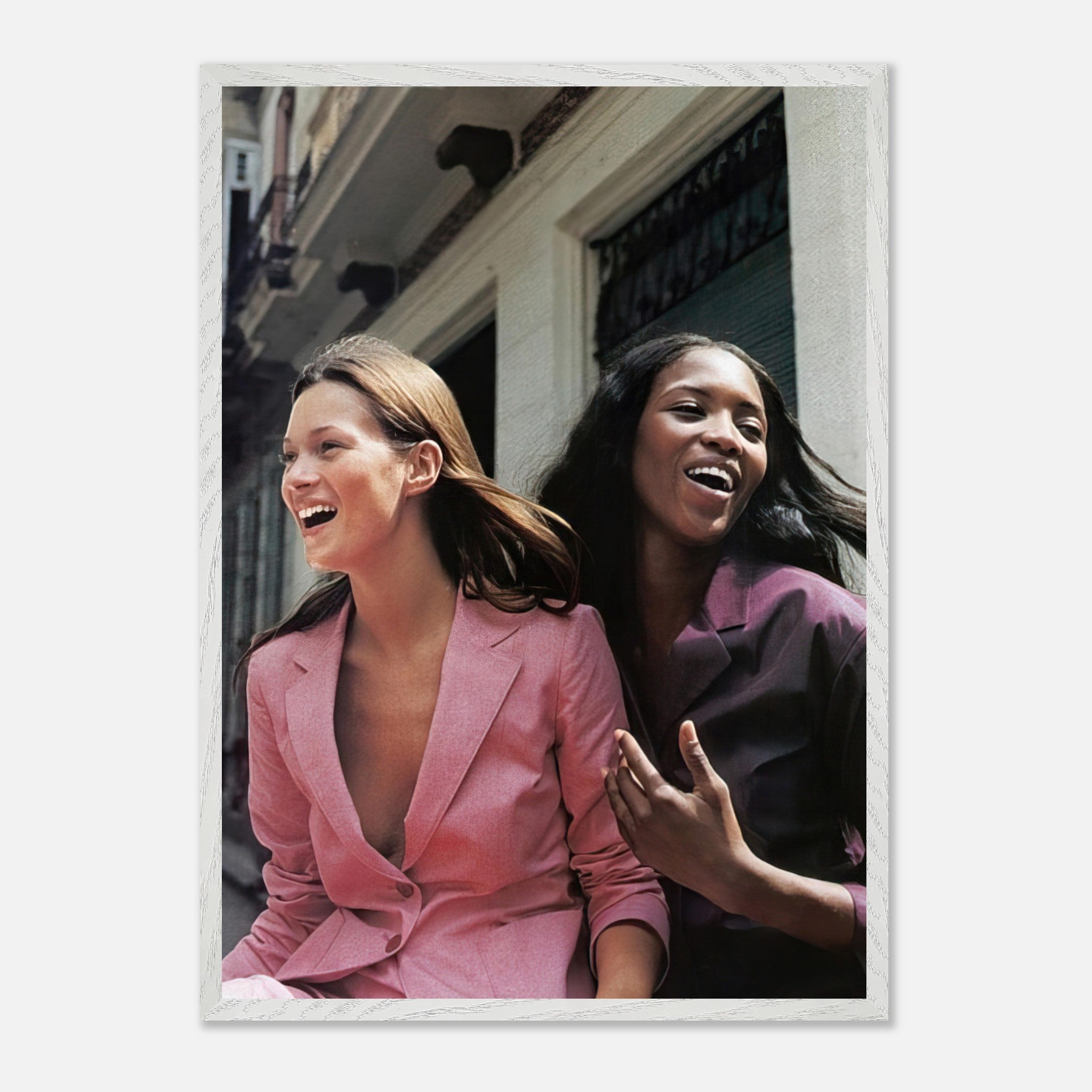 Naomi Campbell and Kate Moss laughing in vintage framed print, showcasing timeless elegance and iconic fashion history.