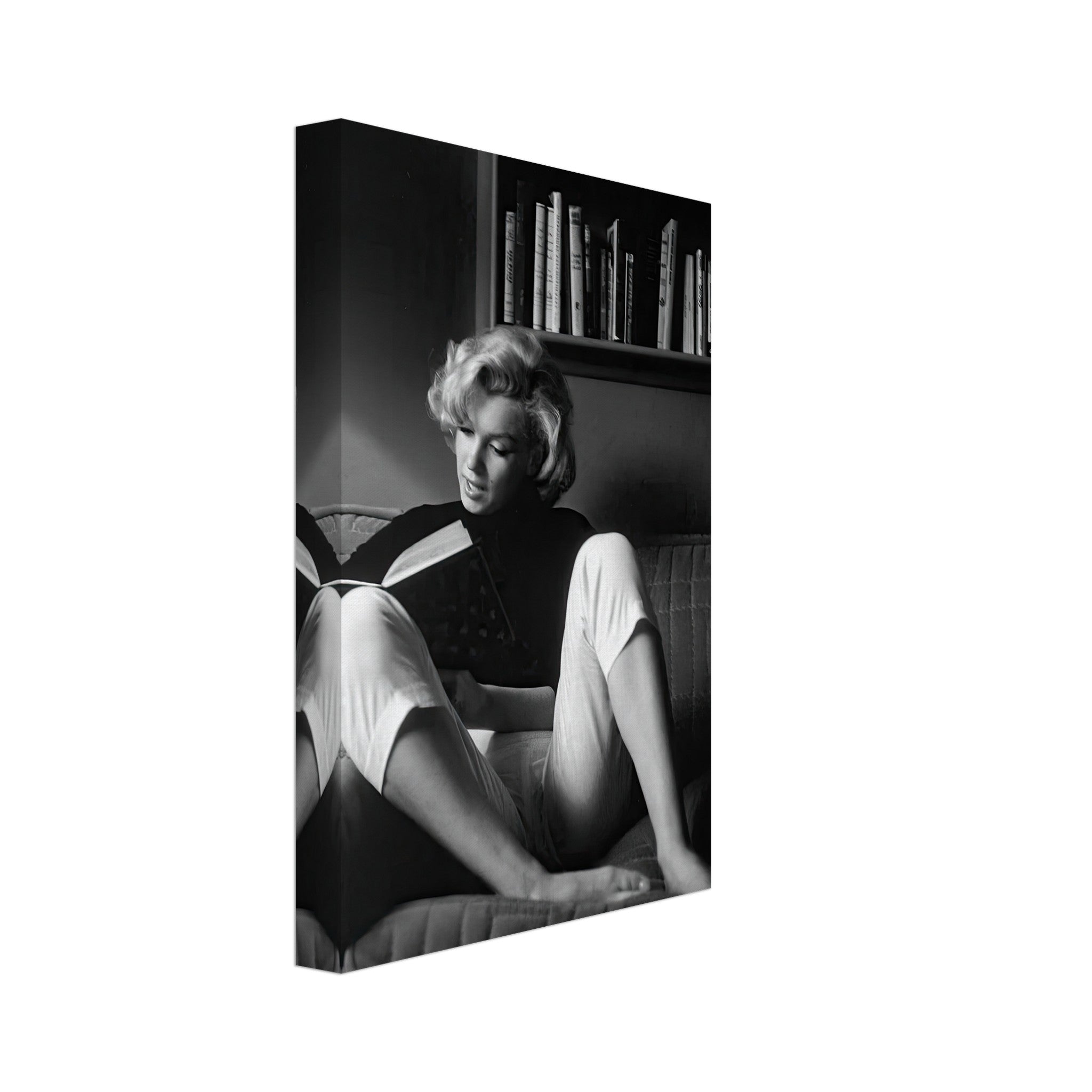Marilyn Monroe reading at home in a black-and-white canvas, exuding elegance and Hollywood glamour.