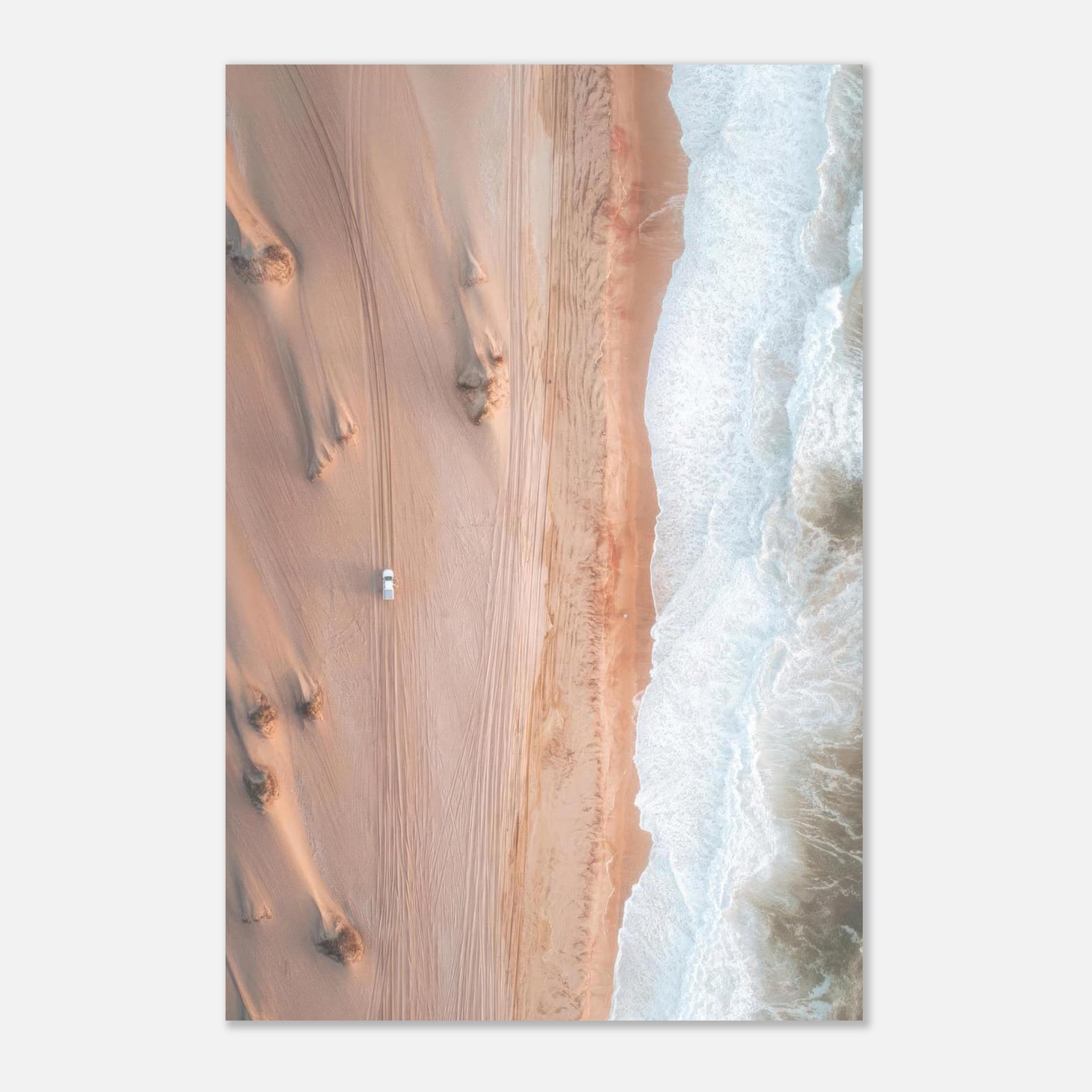 Aerial view of golden desert sands meeting the ocean waves in a stunning drone photography metal print.