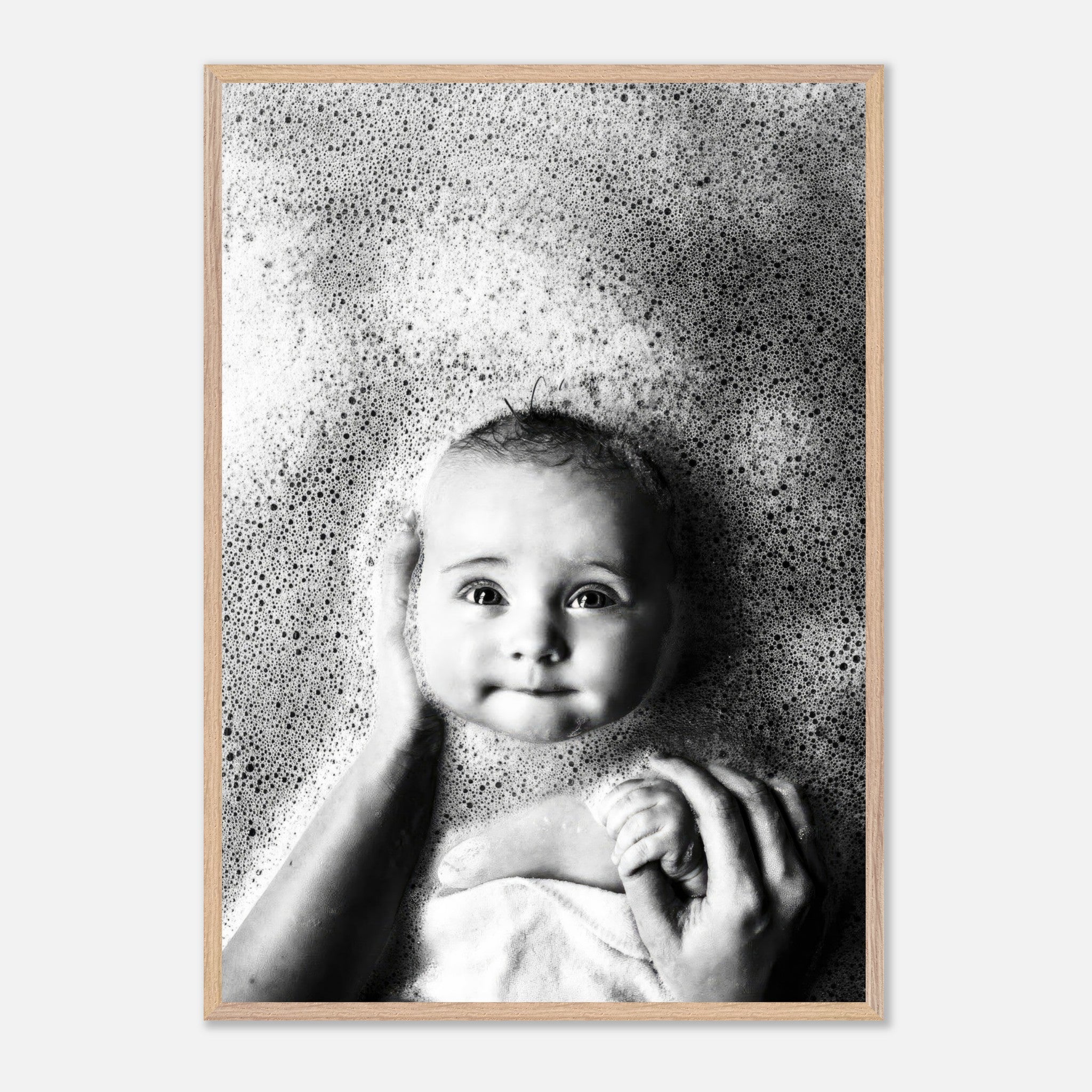 Vintage framed print of a serene baby in bubbles, capturing childhood innocence in black and white photography.