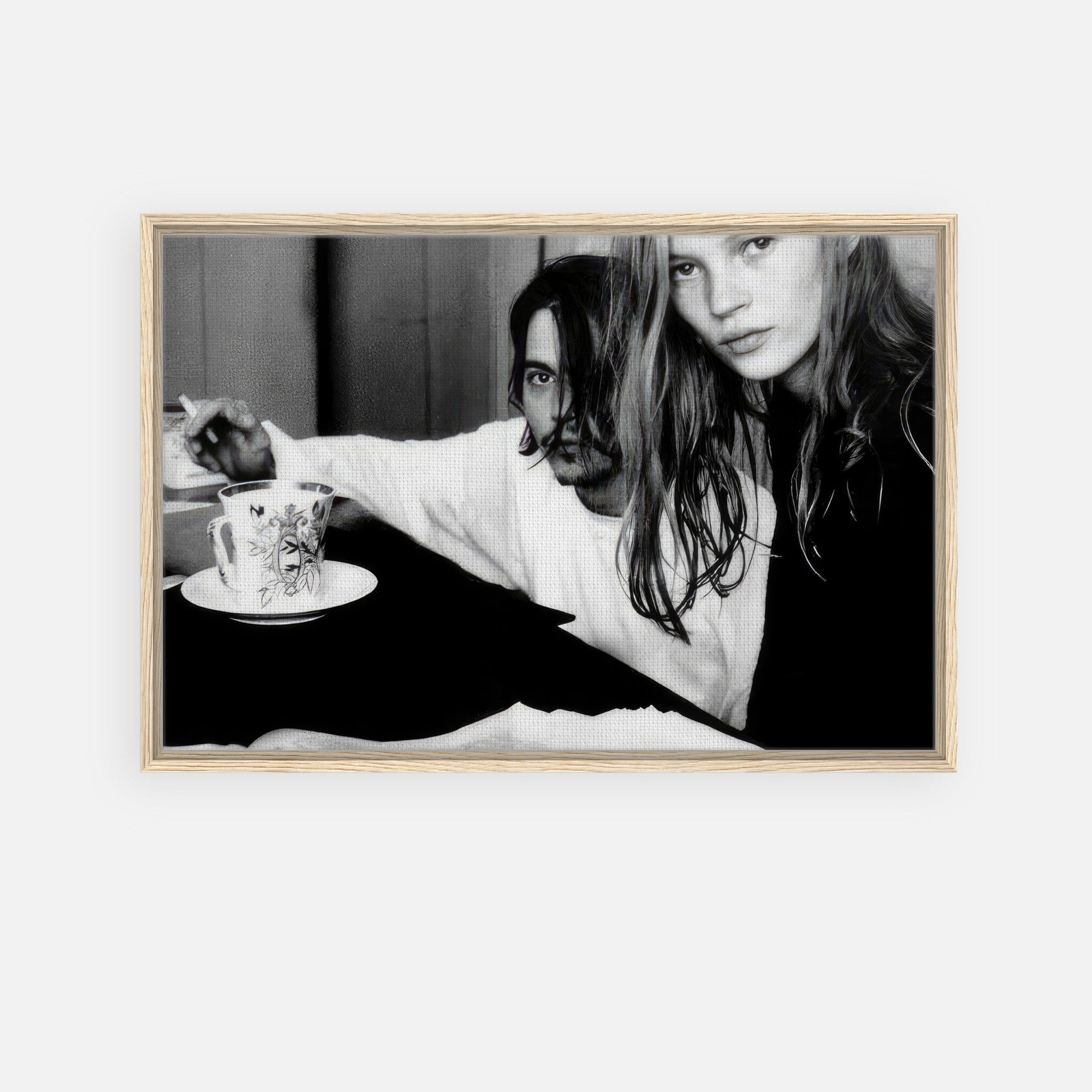 Framed canvas print of Johnny Depp and Kate Moss, capturing 1990s celebrity romance in black and white.