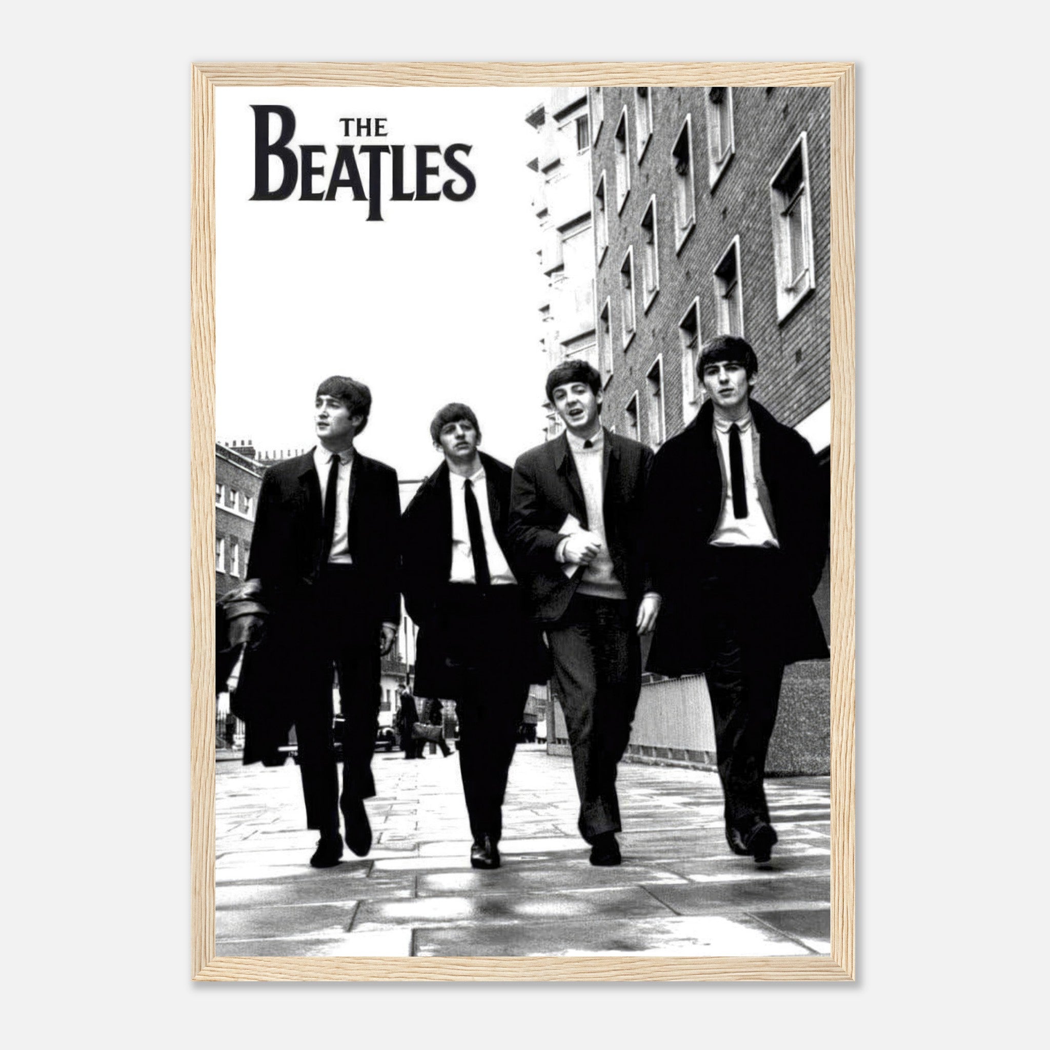 The Beatles framed print featuring iconic black and white image of the band walking together.