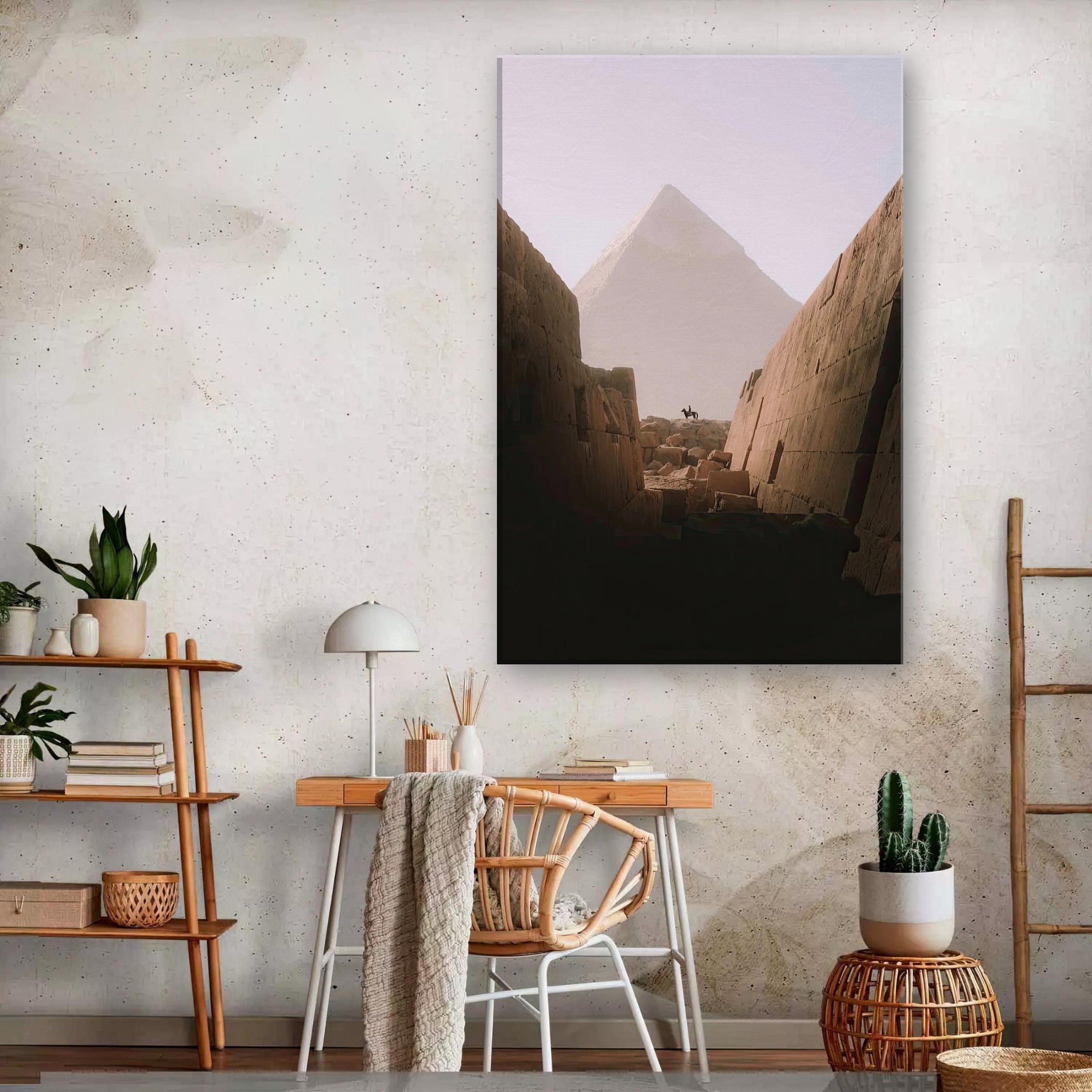 Canvas print of the Great Pyramid of Giza seen from between ancient stones, highlighting desert hues and serene atmosphere.