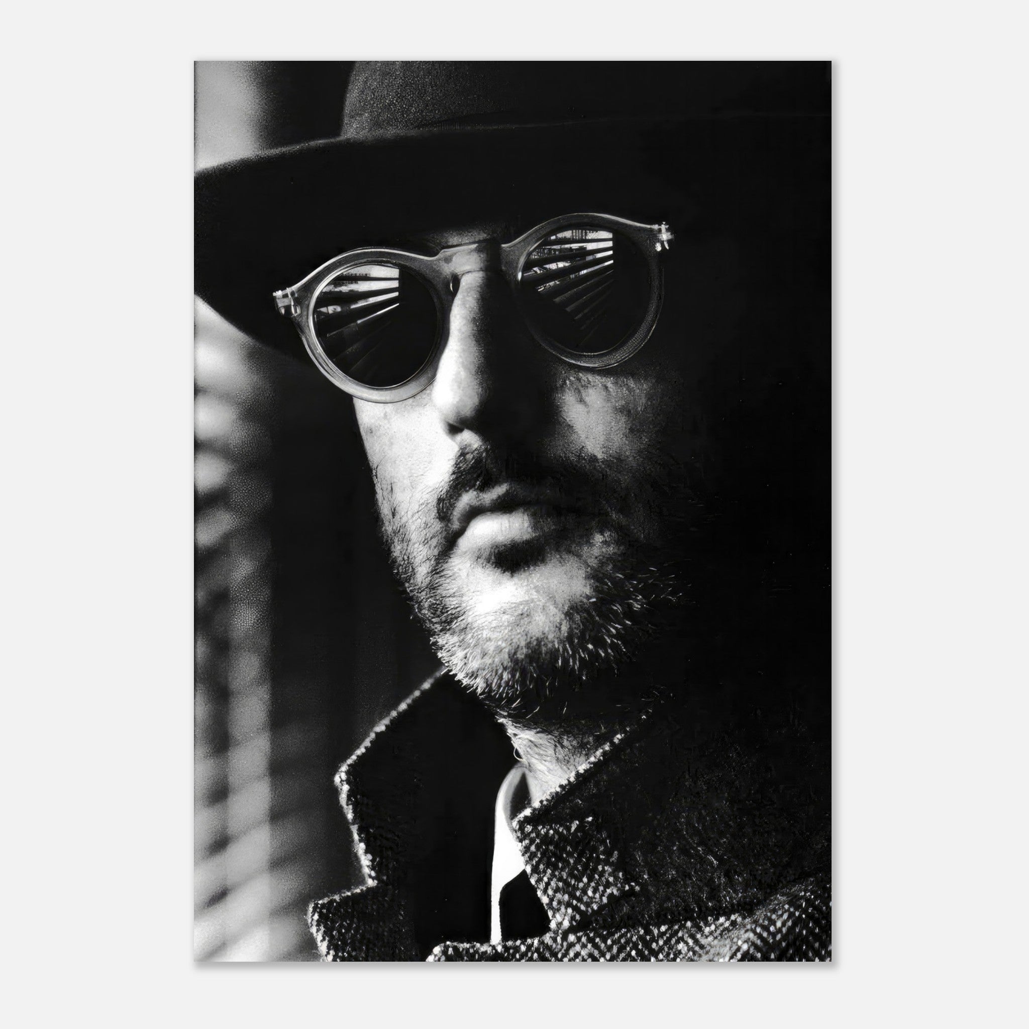 Black-and-white Jean Reno Leon portrait poster showcasing mystery with sunglasses and coat.