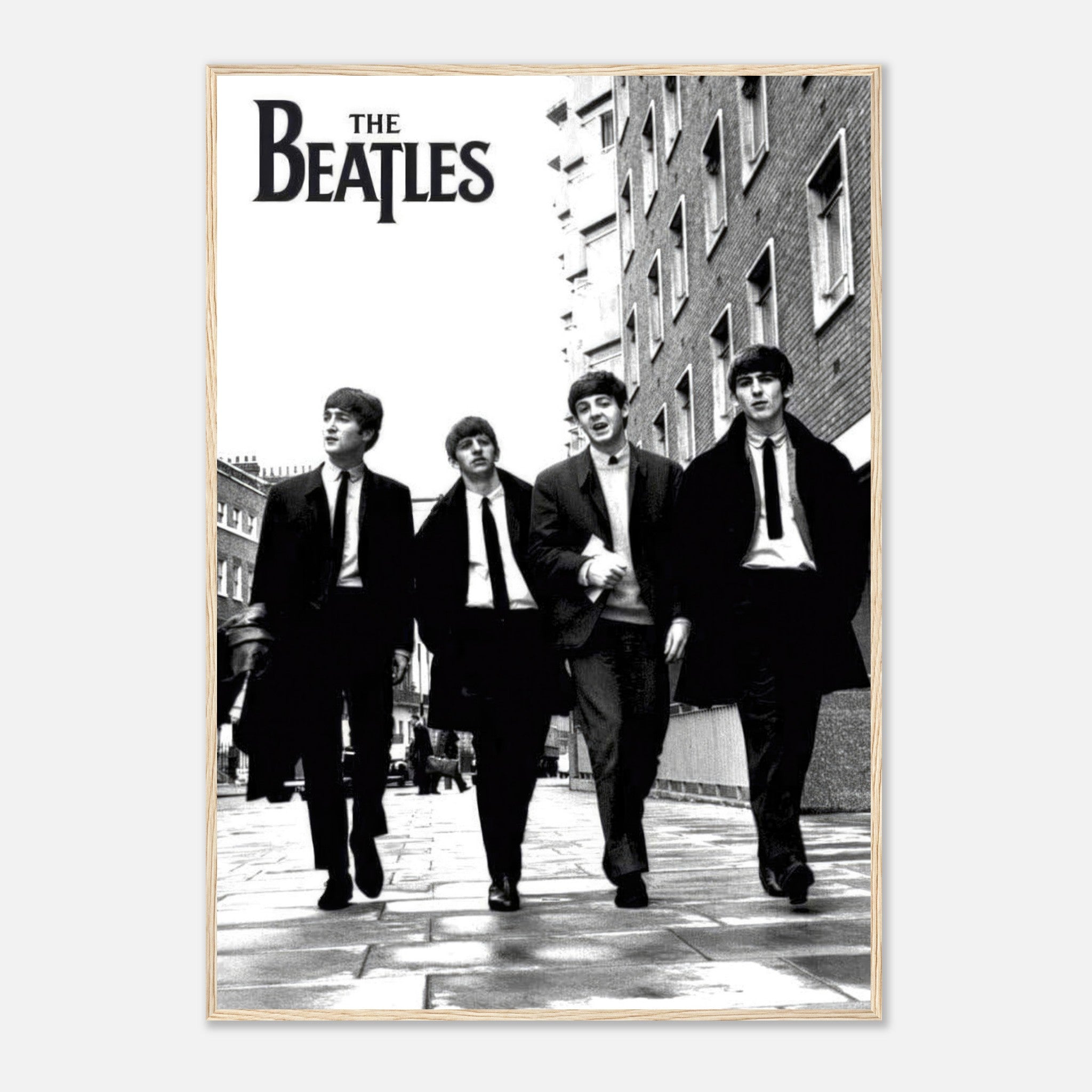 The Beatles cover framed print featuring iconic black and white photo of the band walking together.