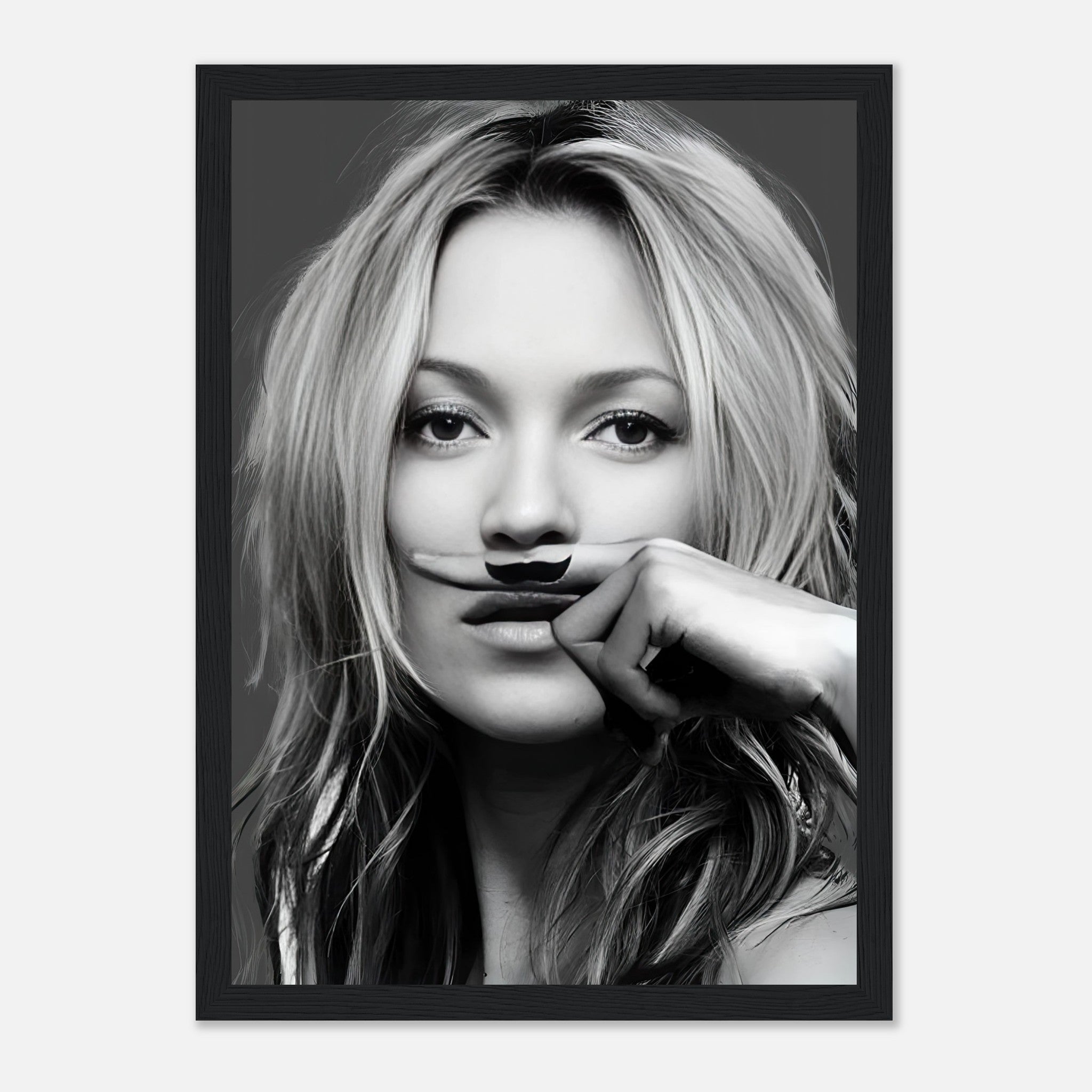 Kate Moss Mustache Framed Print featuring a stylish black-and-white portrait with a playful mustache design.