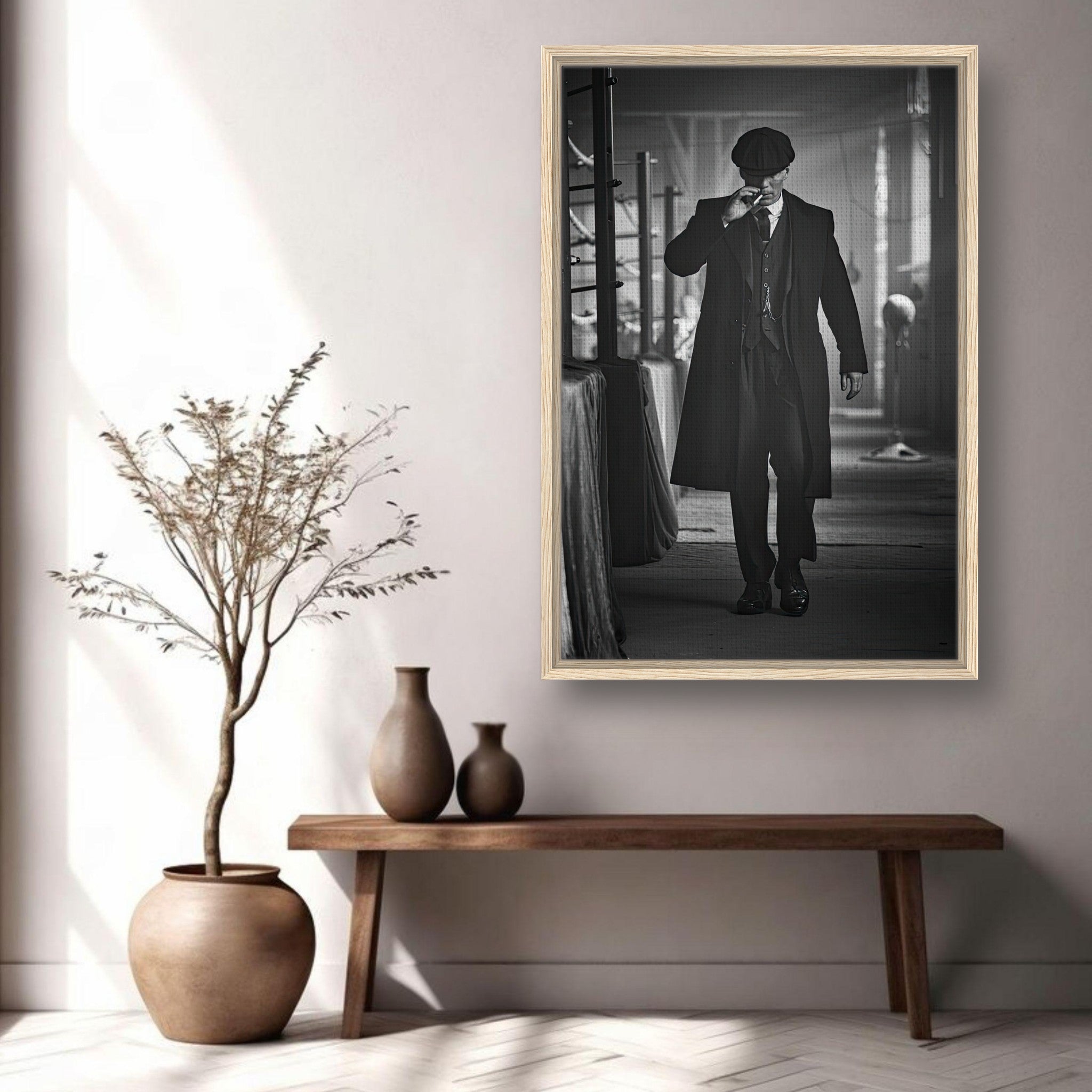 Framed canvas print of Tommy Shelby from Peaky Blinders, showcasing his iconic style and presence in a monochrome setting.