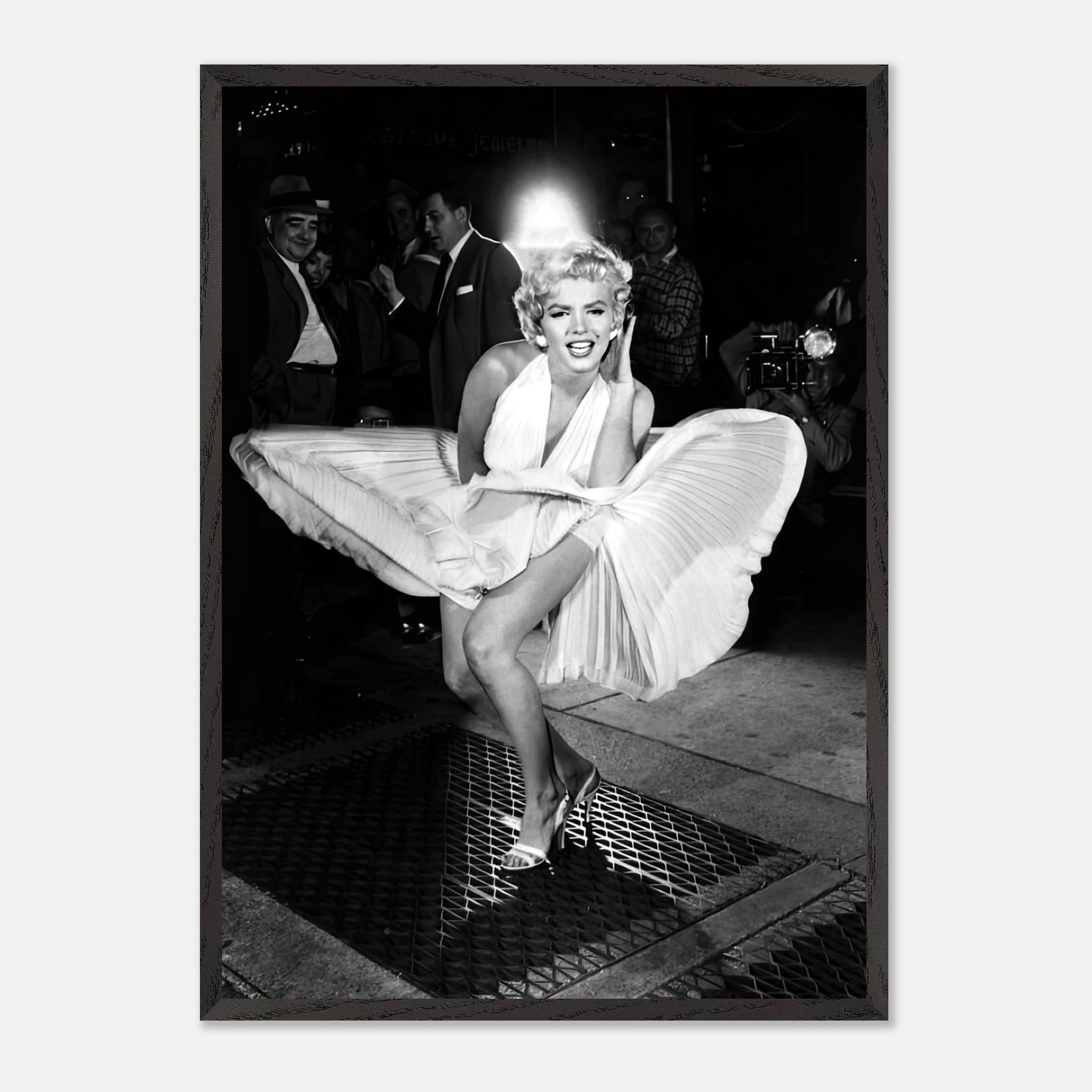 Marilyn Monroe vintage photograph in white dress, wind-blown, showcasing timeless Hollywood glamour.