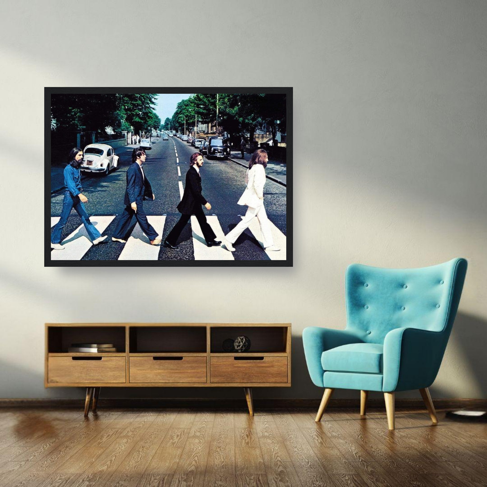 The Beatles Abbey Road framed print displayed in a modern living room with stylish furniture.