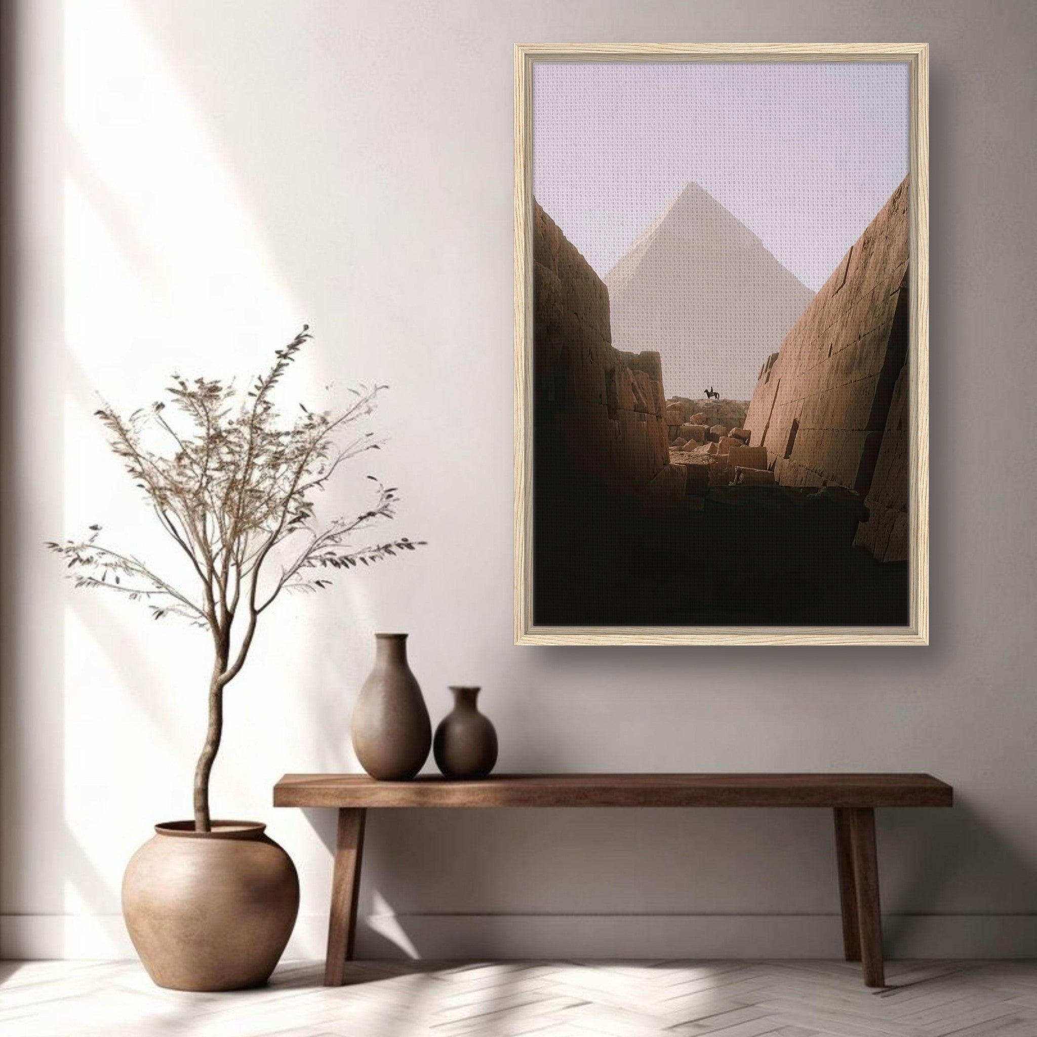 Framed canvas print of the Great Pyramid of Giza displayed in a modern interior setting with decorative elements.