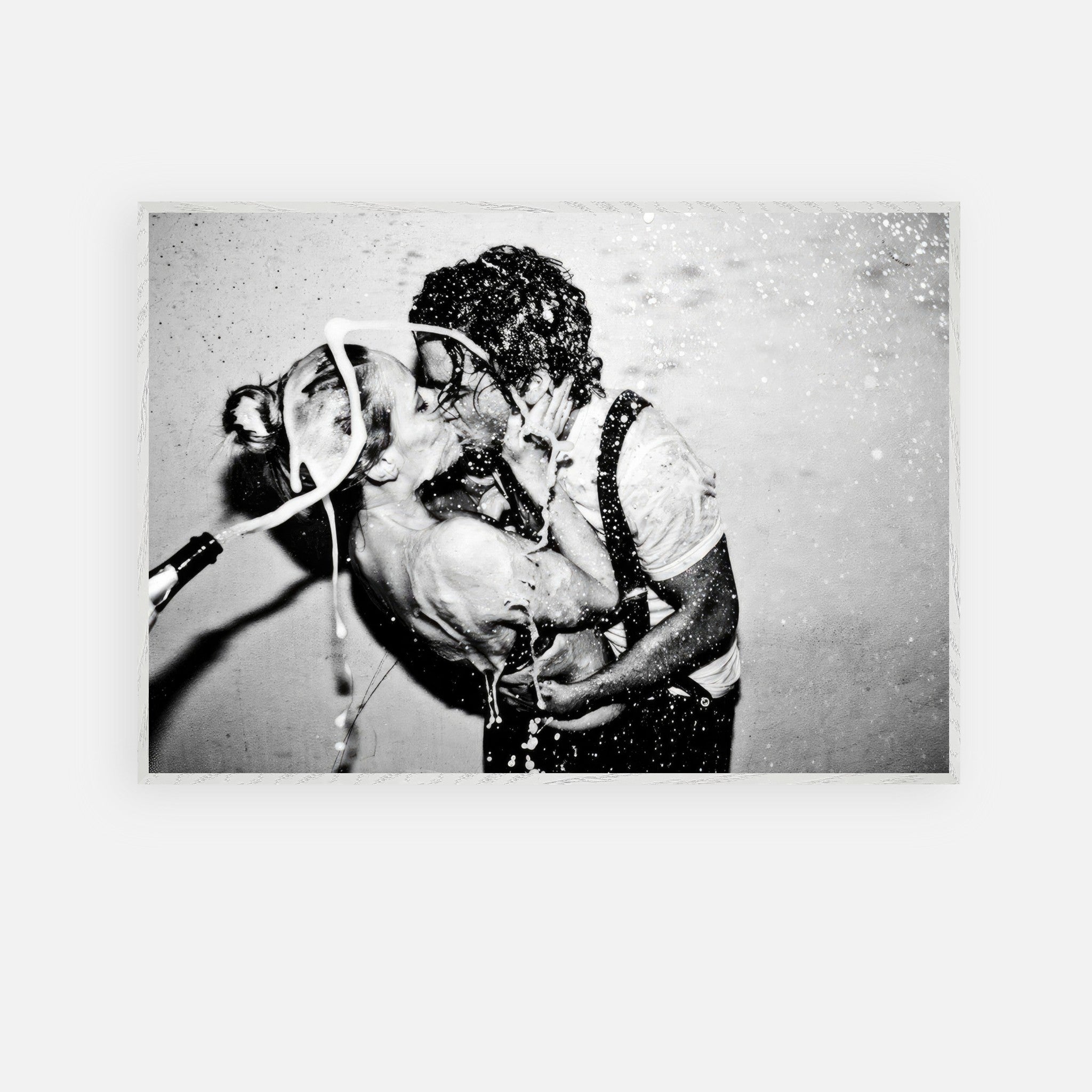 The Champagne Kiss fine art print of Johnny Depp and Kate Moss in a passionate black-and-white moment.