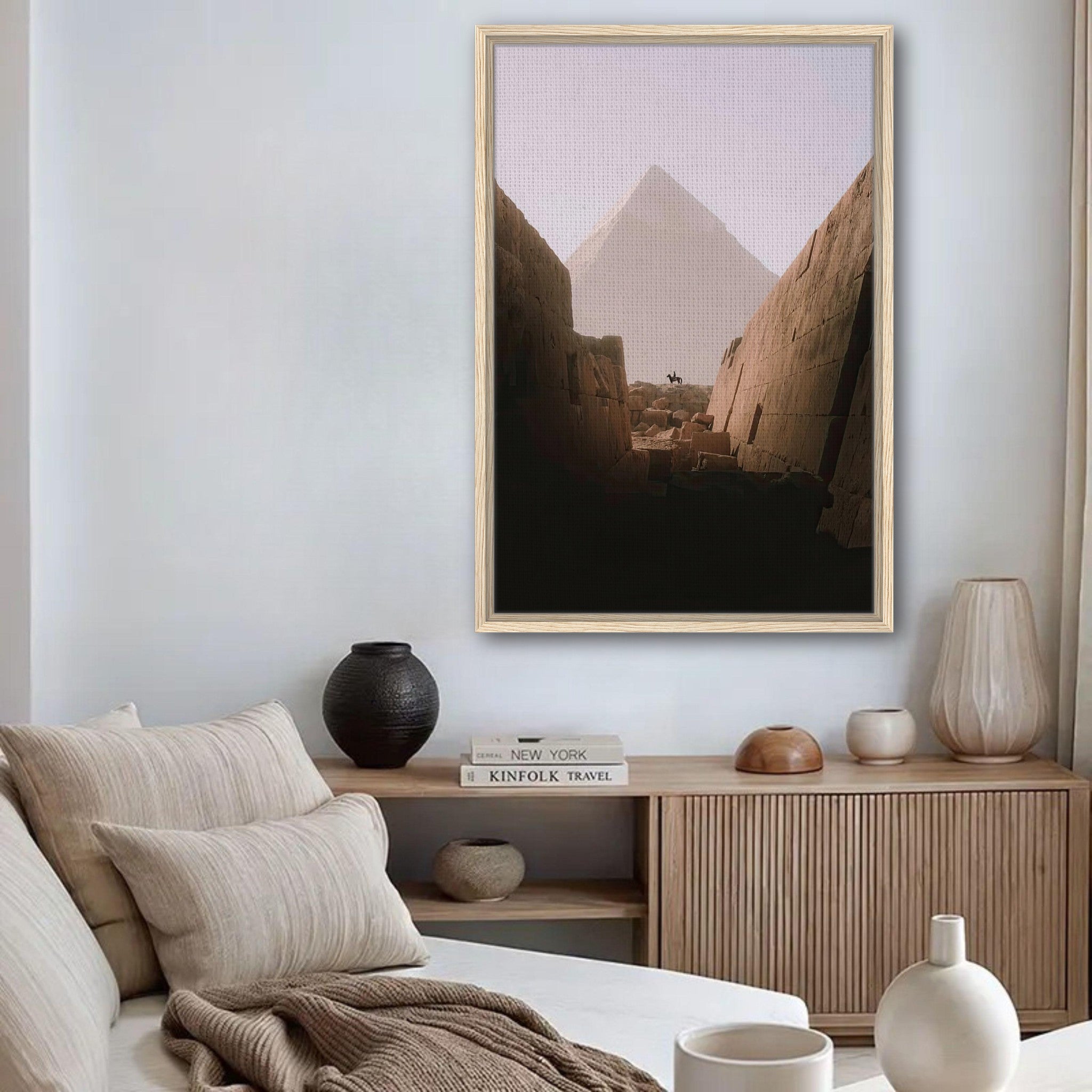 Framed print of the Great Pyramid of Giza displayed in a cozy living room setting.