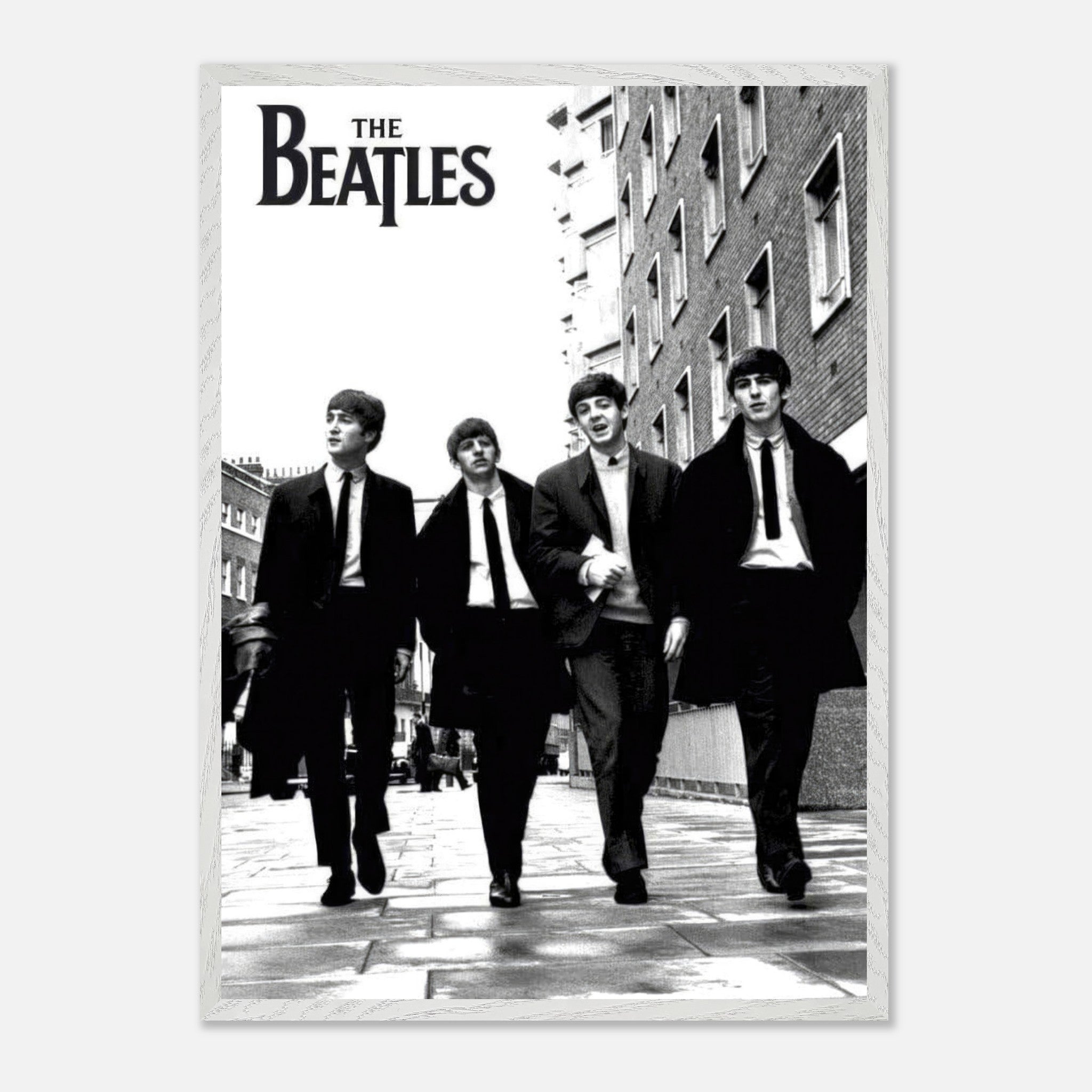 The Beatles fine art cover in black and white, showcasing band members walking together on the street.