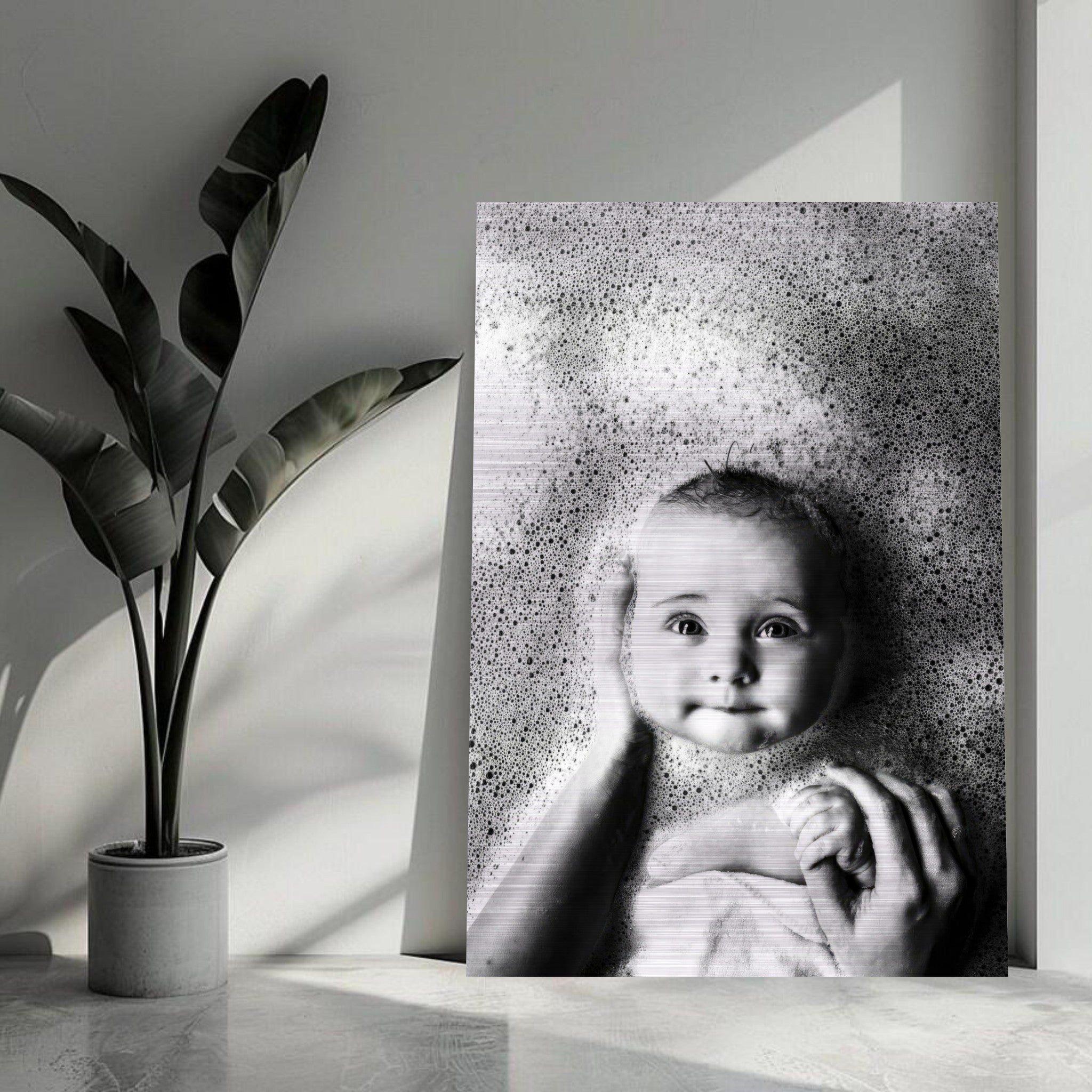 Baby bath photography print on brushed metal, showcasing a serene baby in bubbles with a gentle hand.