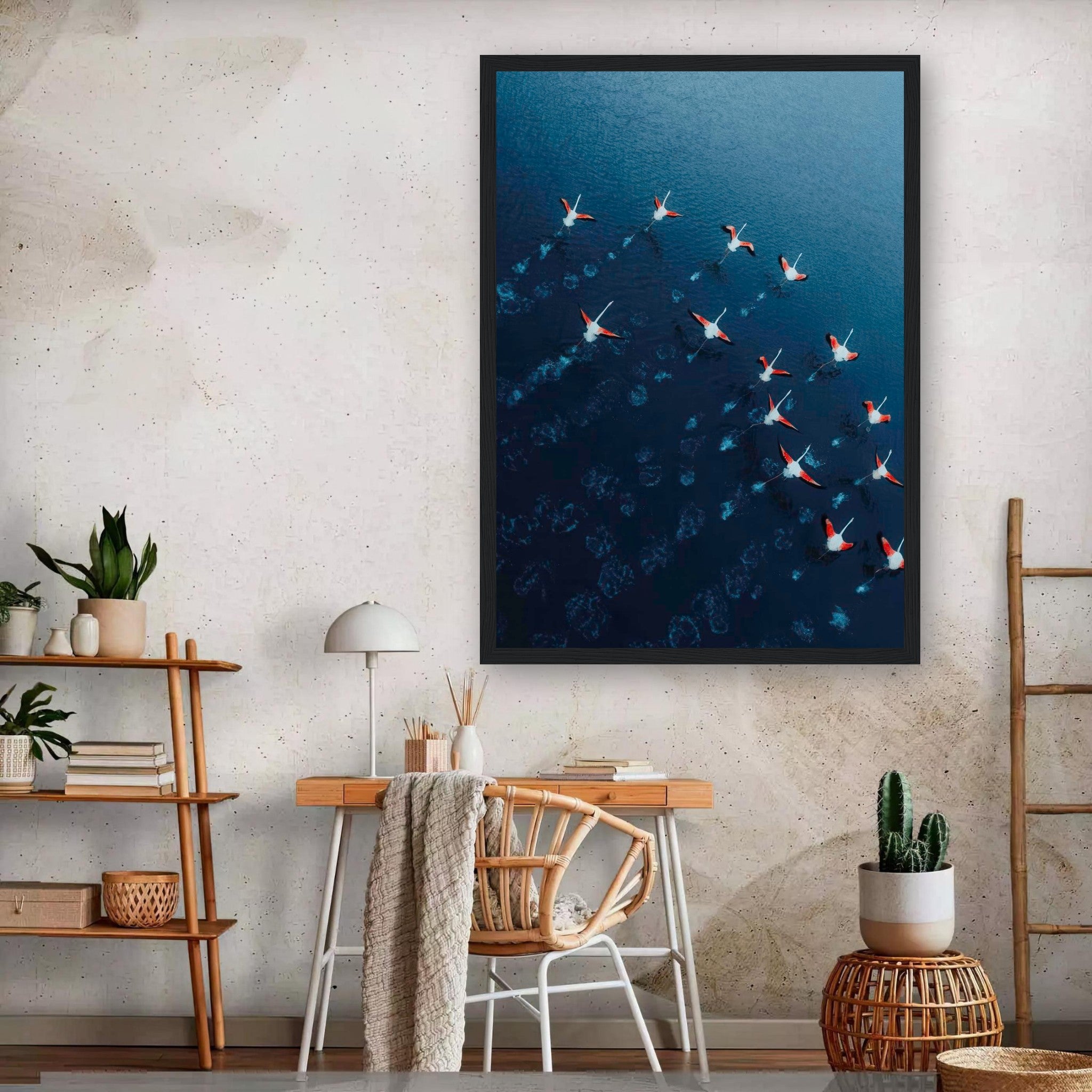 Framed print of flamingos in flight over blue waters, showcasing nature and tranquility in home decor.