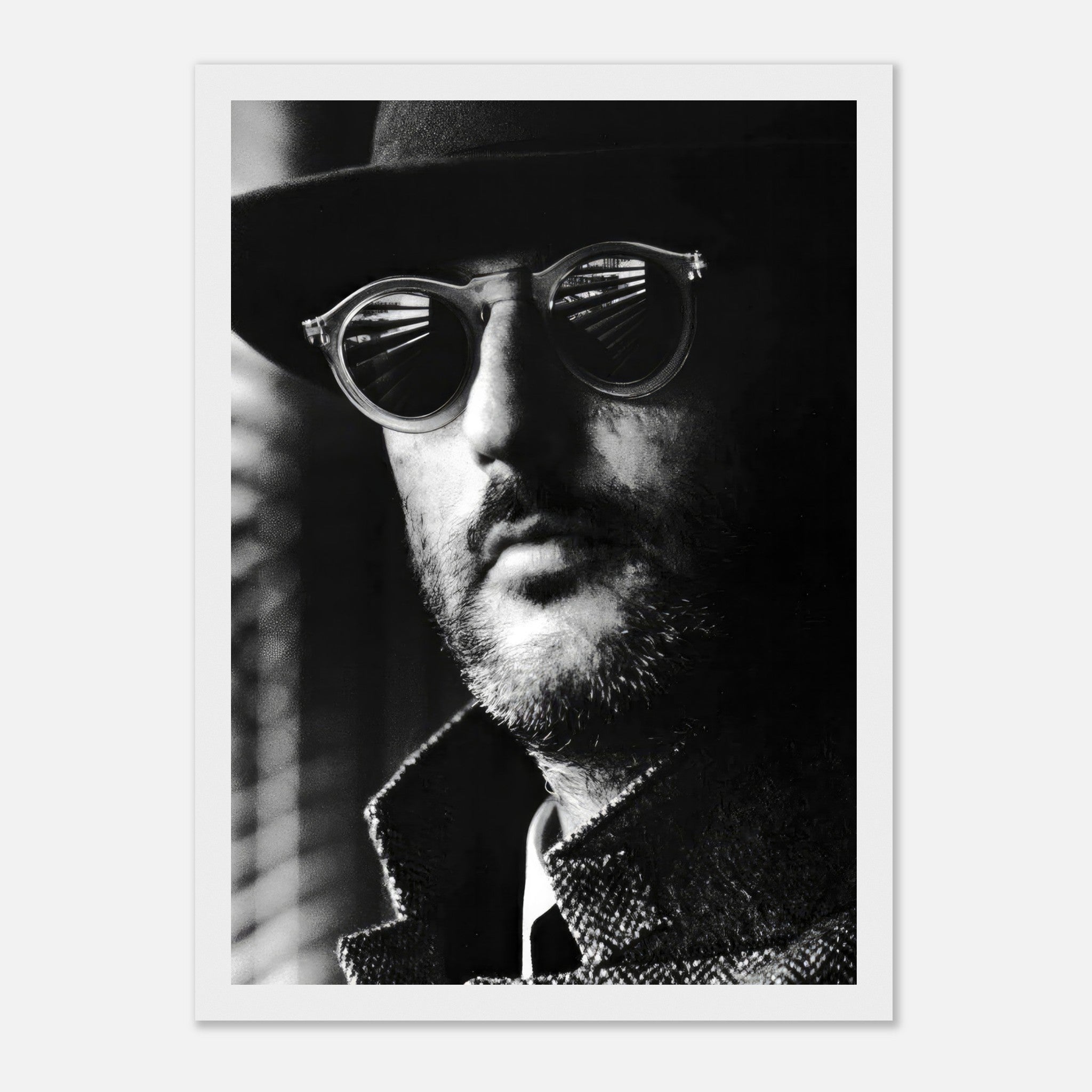 Black-and-white framed print of Jean Reno in sunglasses, capturing a sophisticated and enigmatic cinematic moment.