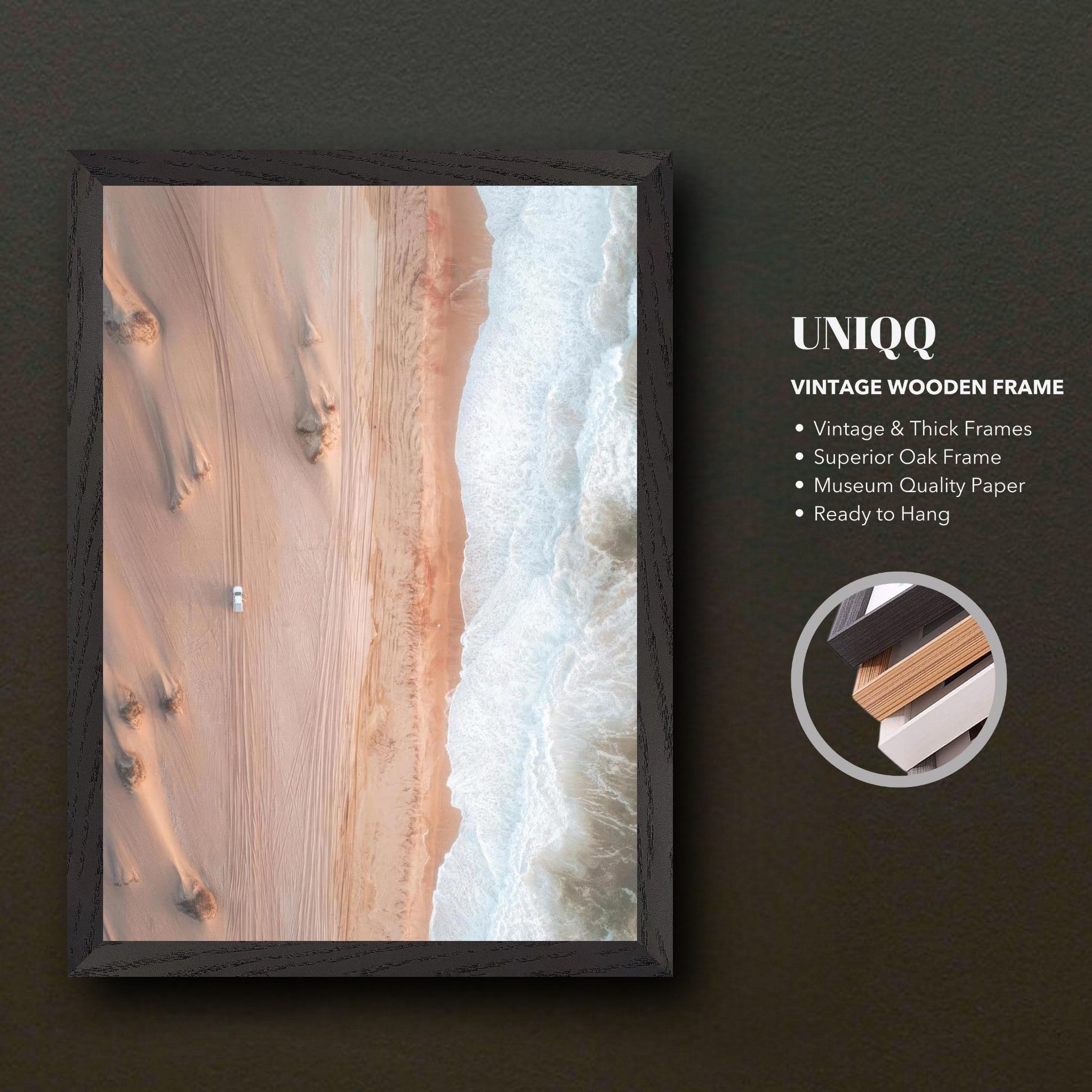 Drone photography print showcasing desert and ocean contrast in a vintage oak frame, ready to hang.