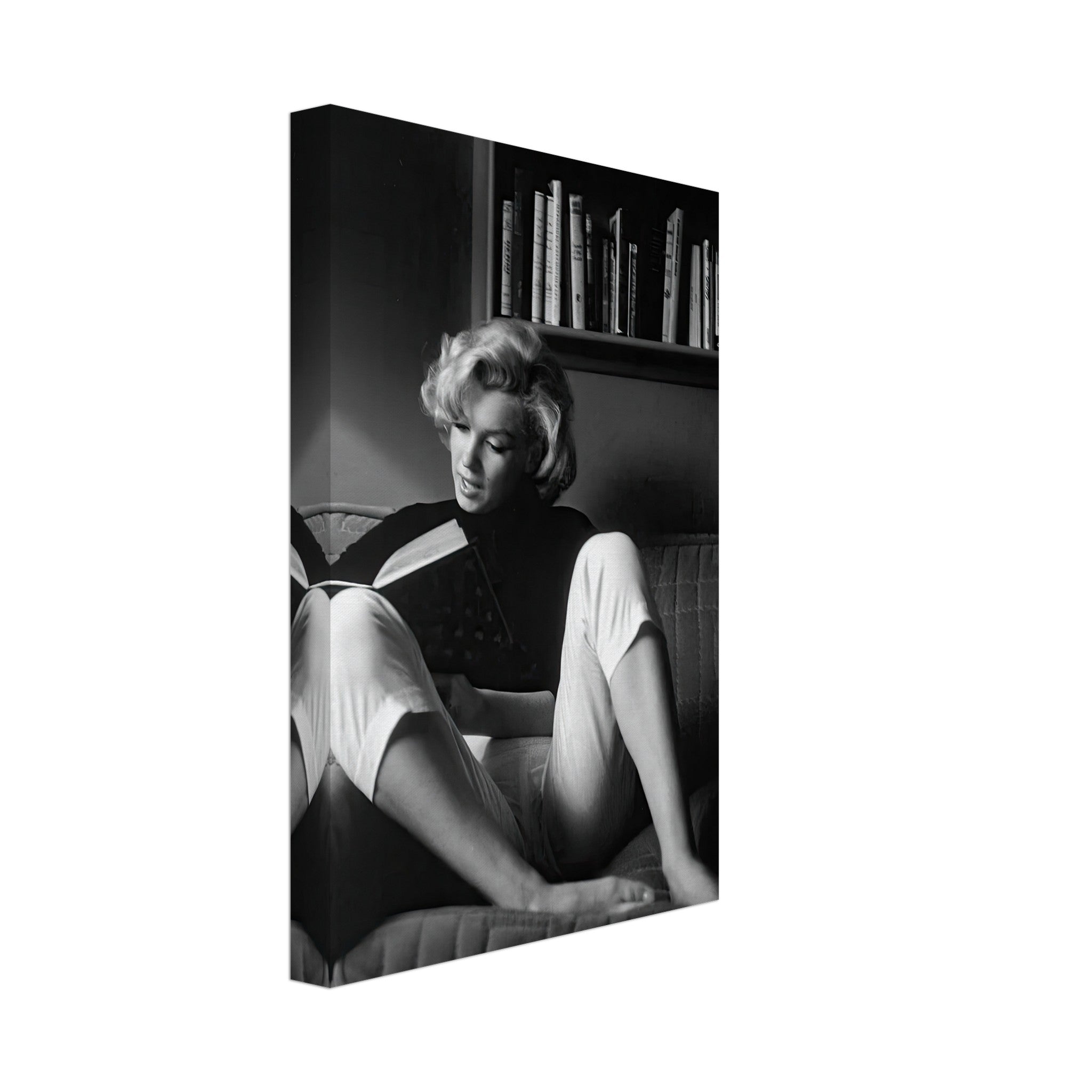 Marilyn Monroe reading at home in a black-and-white canvas art piece, exuding elegance and Hollywood glamour.